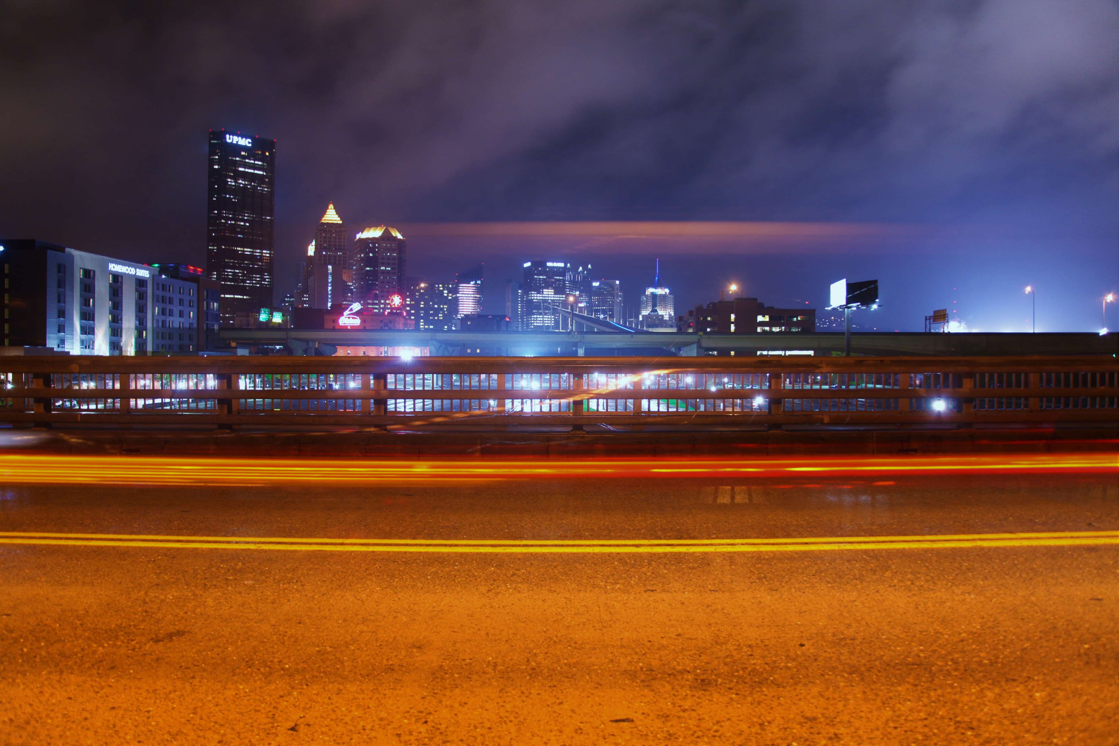 Cityscape at Night with Light Trails HD Wallpaper