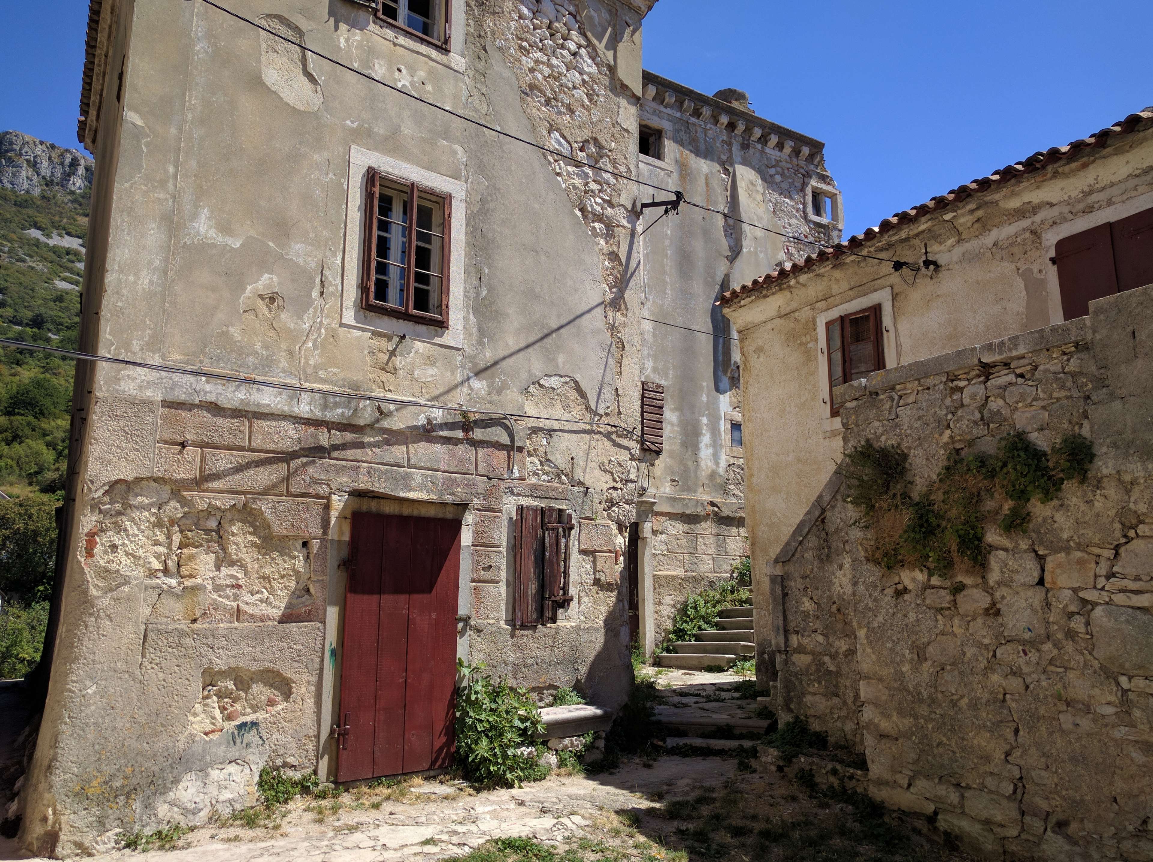 Old stone houses in a narrow street HD Wallpaper
