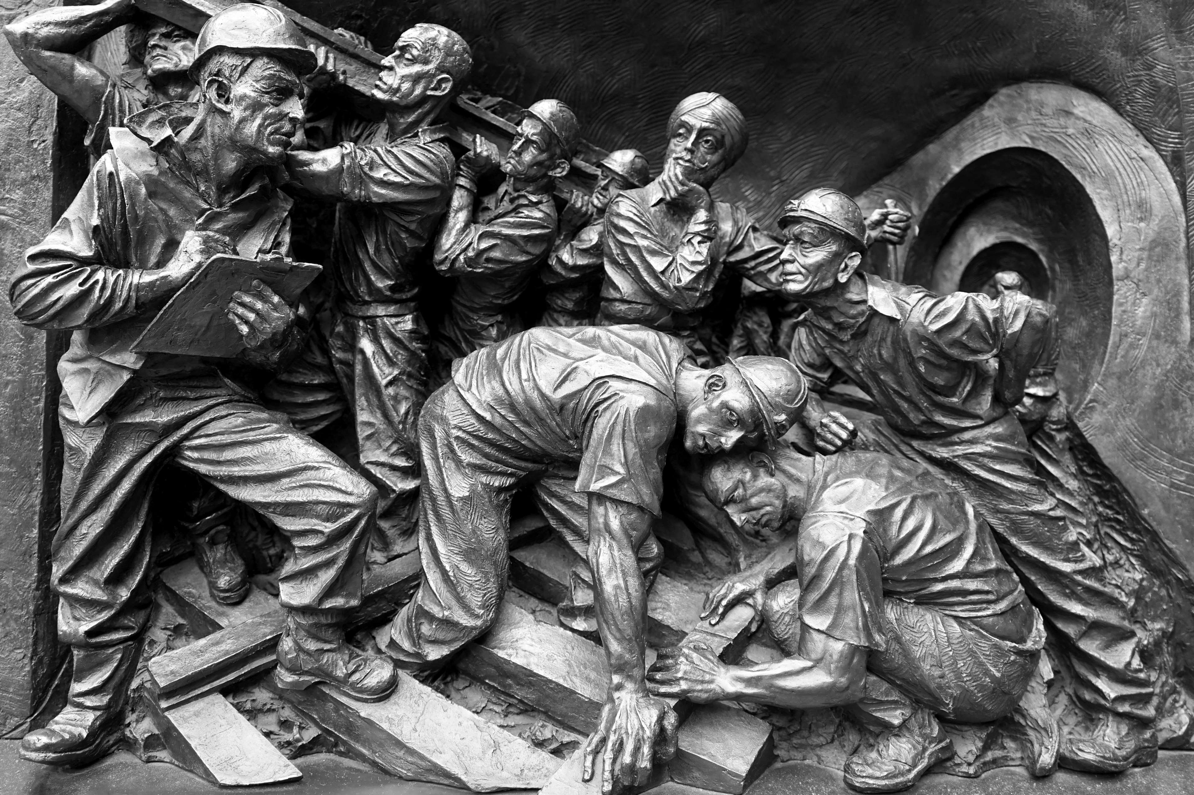 Sculpture of miners working in a tunnel HD Wallpaper