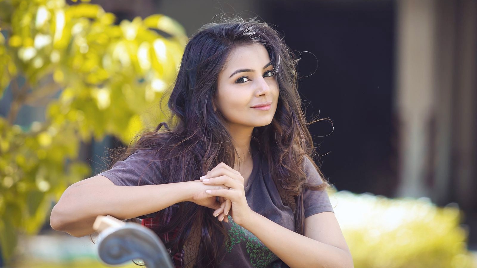 Indian girl sitting on a bench outdoors HD Wallpaper