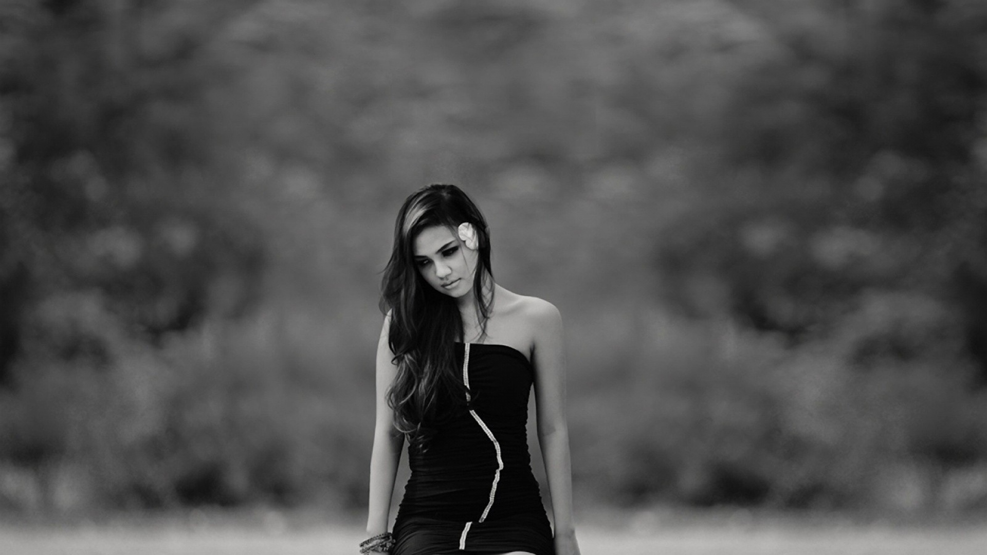 Monochrome portrait of a sad girl with a flower HD Wallpaper