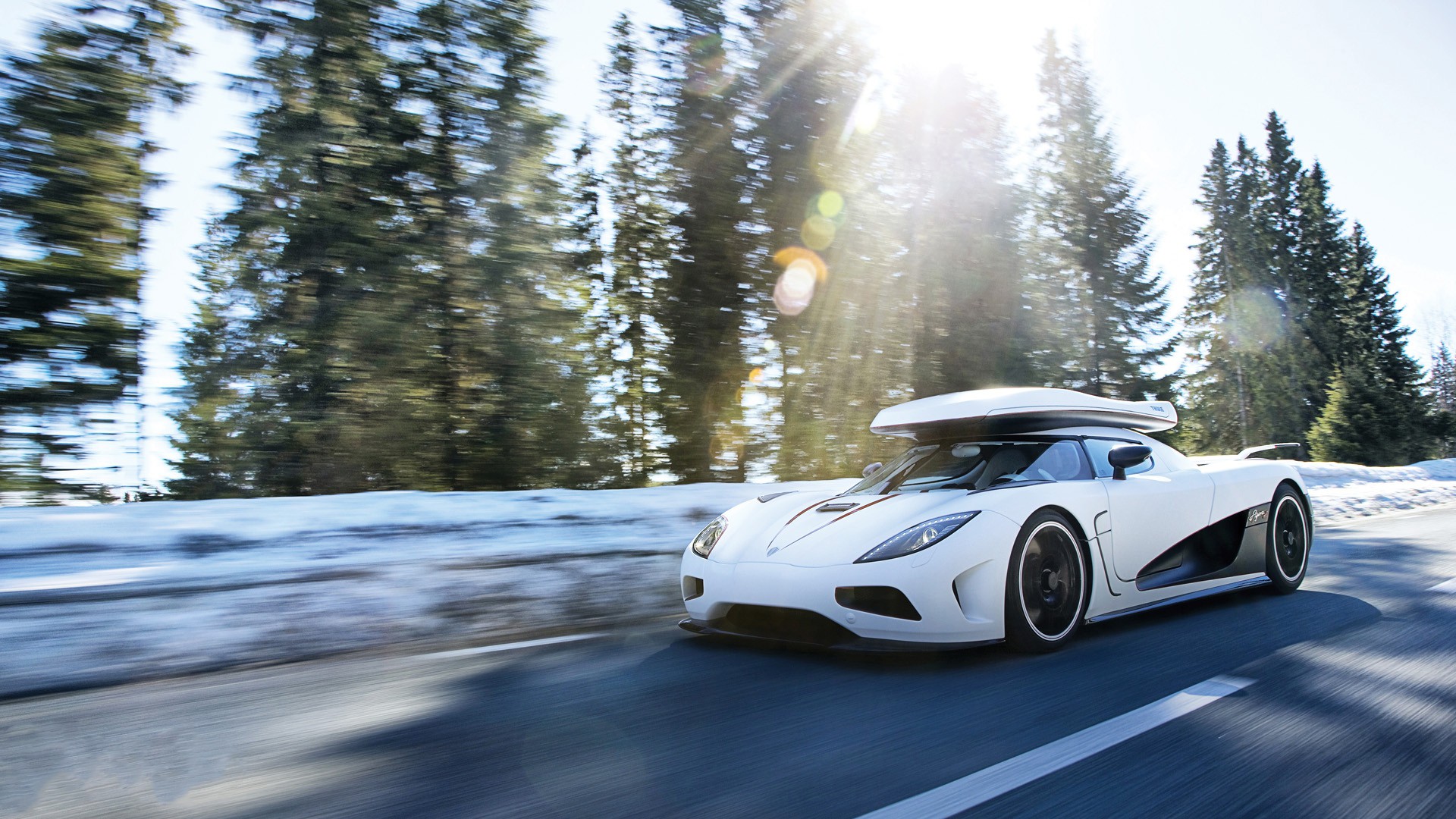 White Koenigsegg Agera with Roof Box Driving in Snow HD Wallpaper