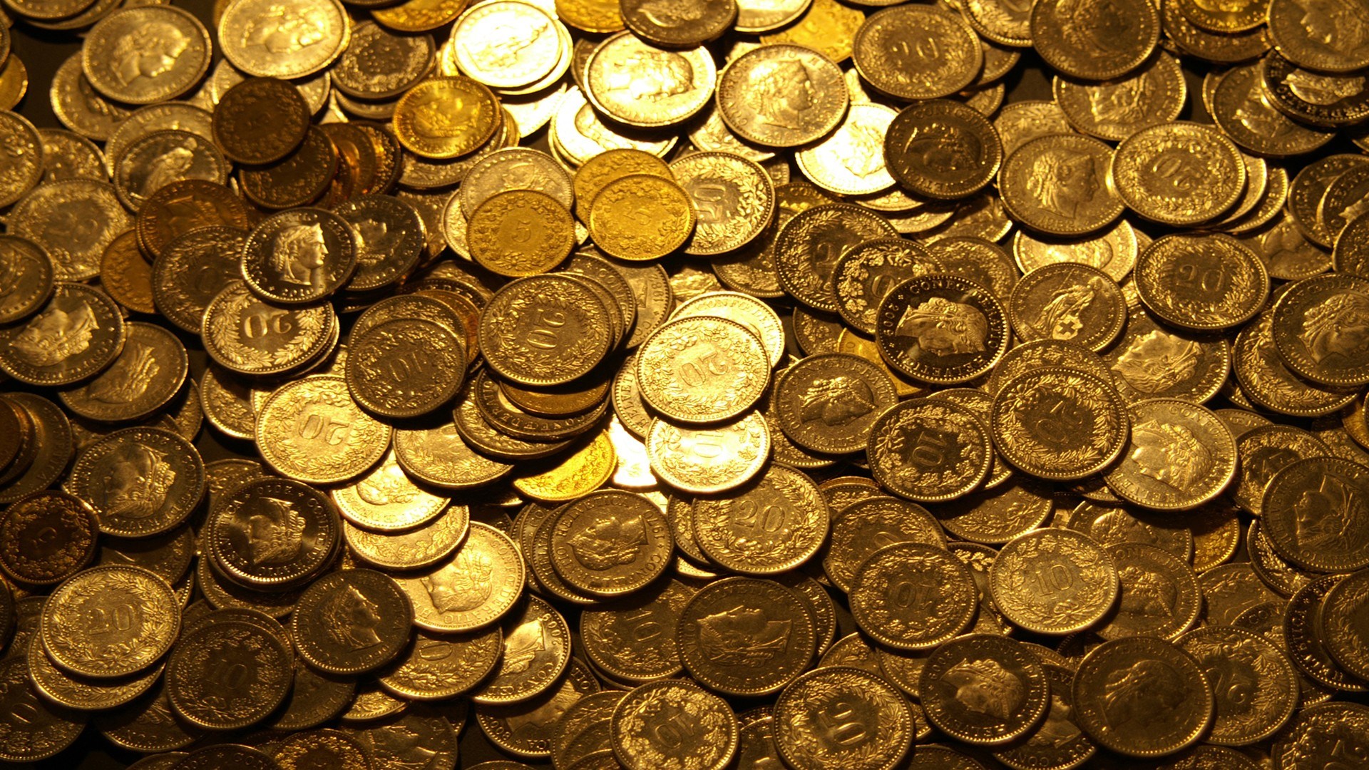 Pile of gold Swiss coins HD Wallpaper
