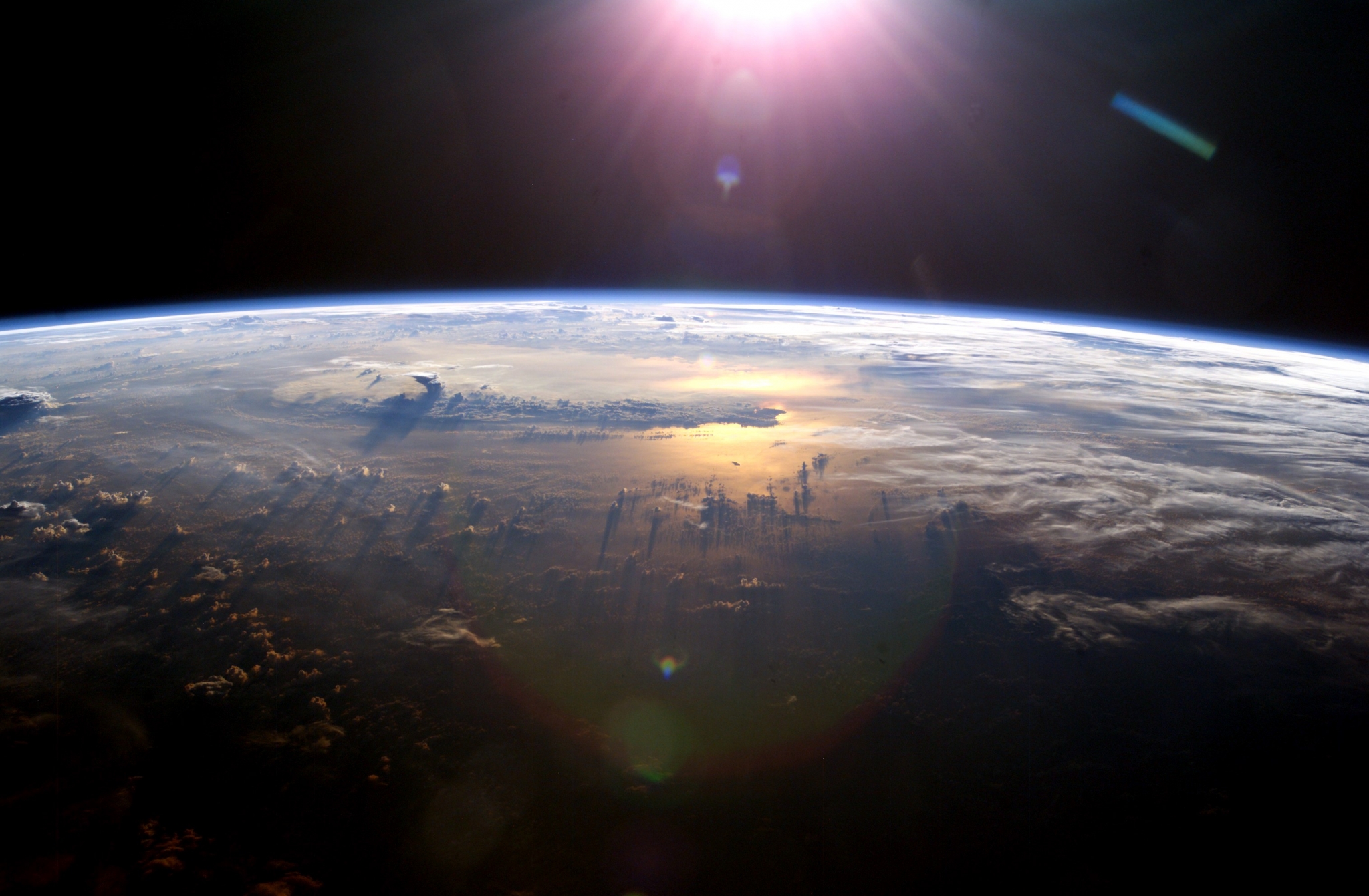 Earth from space with sun glare HD Wallpaper