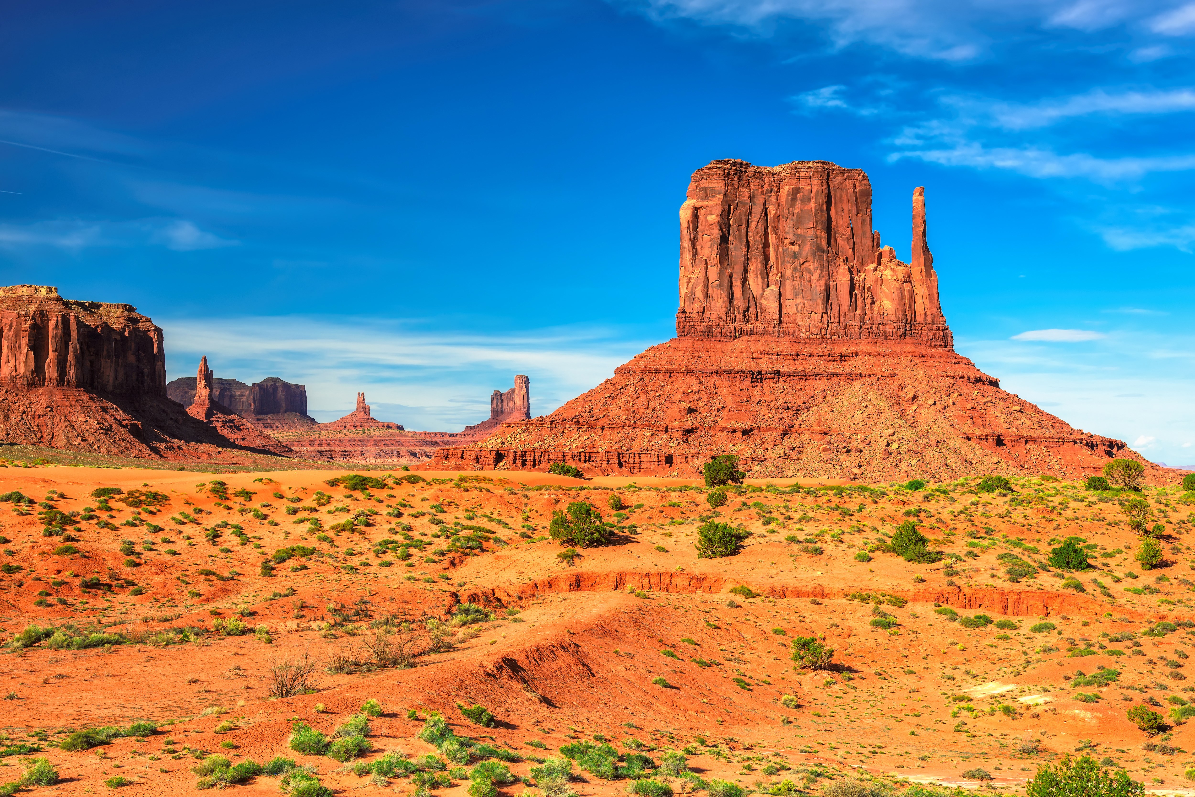 Monument Valley landscape with mesas and blue sky HD Wallpaper