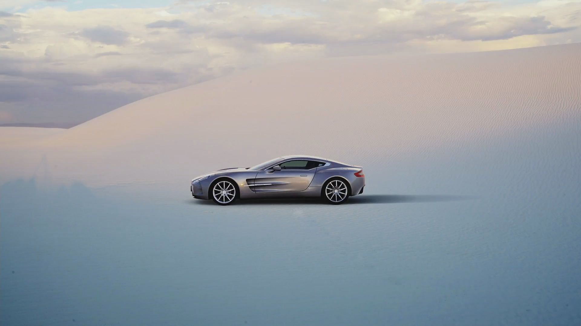 Silver Aston Martin Gran Turismo Sport in desert HD Wallpaper