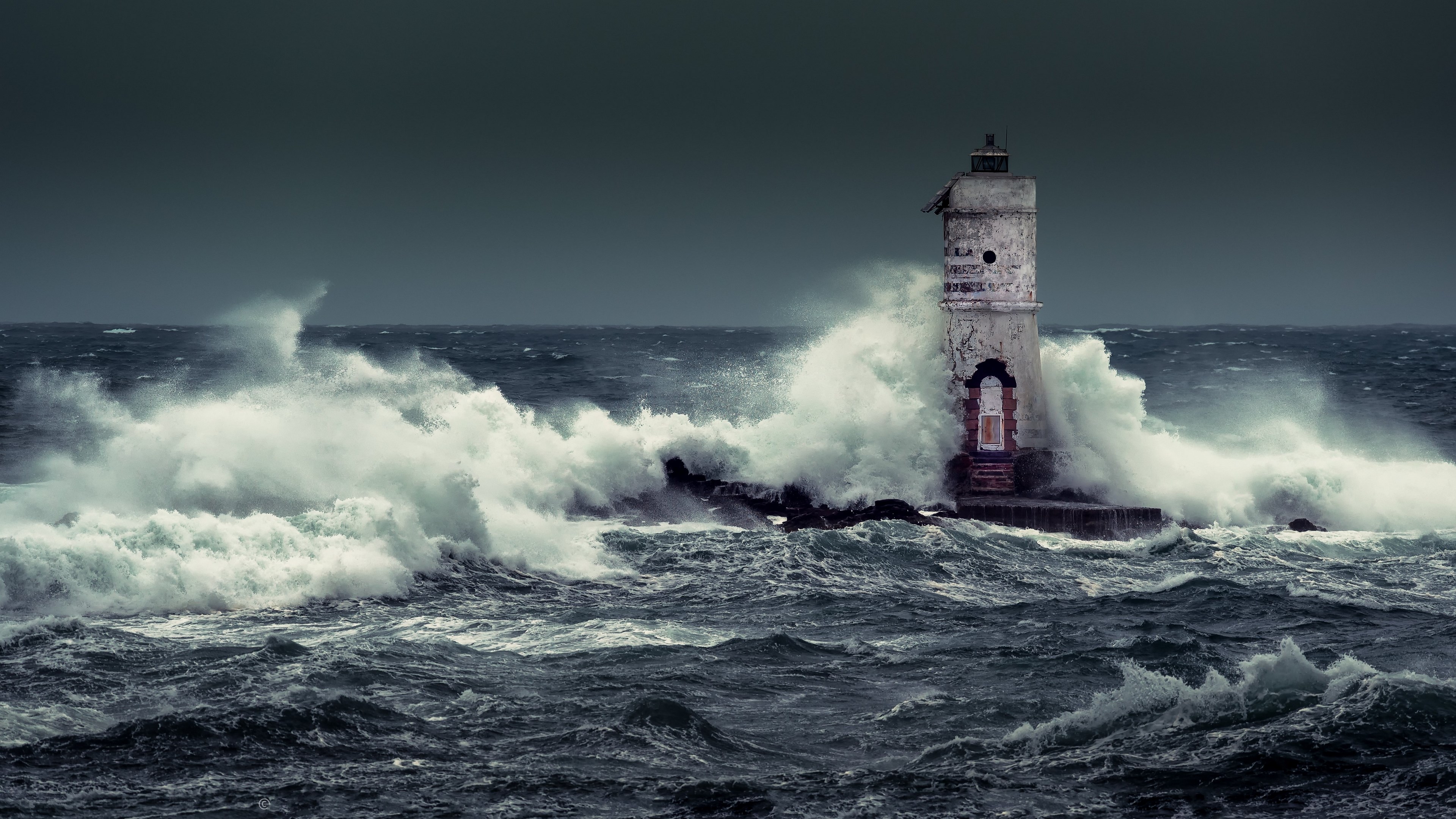 4K Lighthouse in Stormy Seas HD Wallpaper