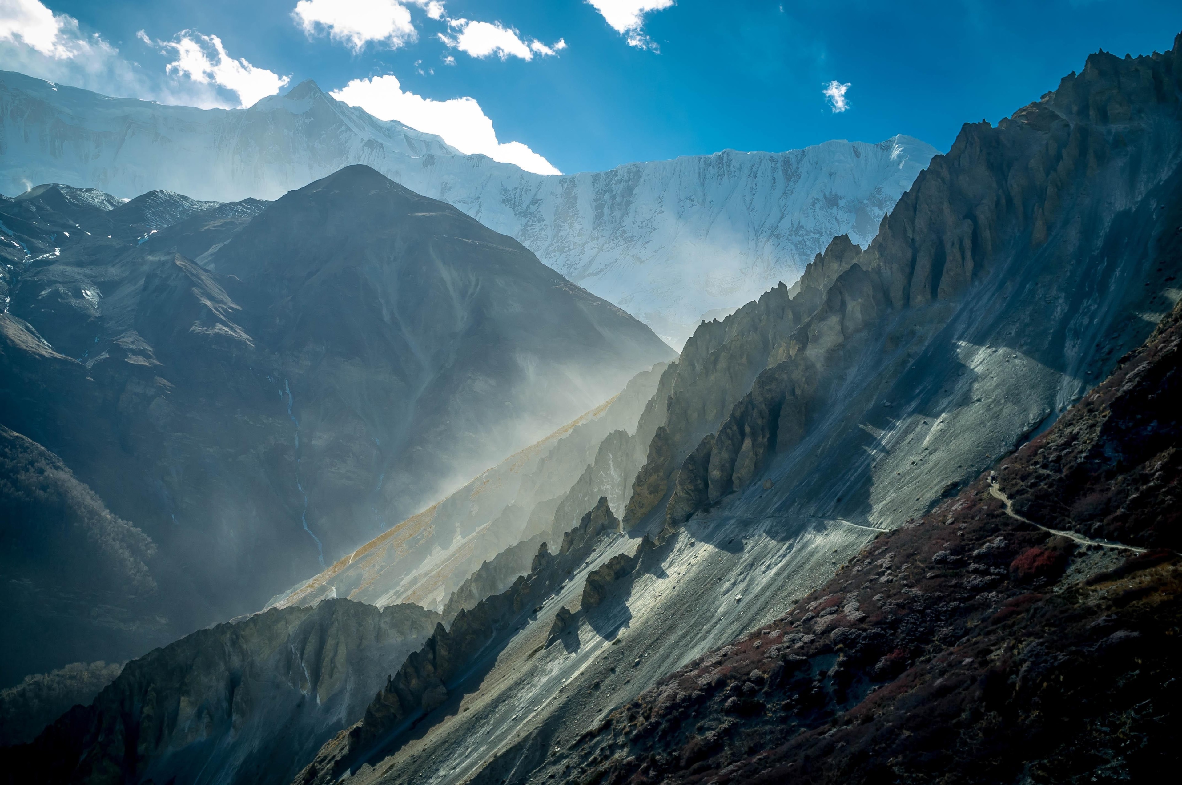 Sunlight on Misty Mountain Peaks HD Wallpaper