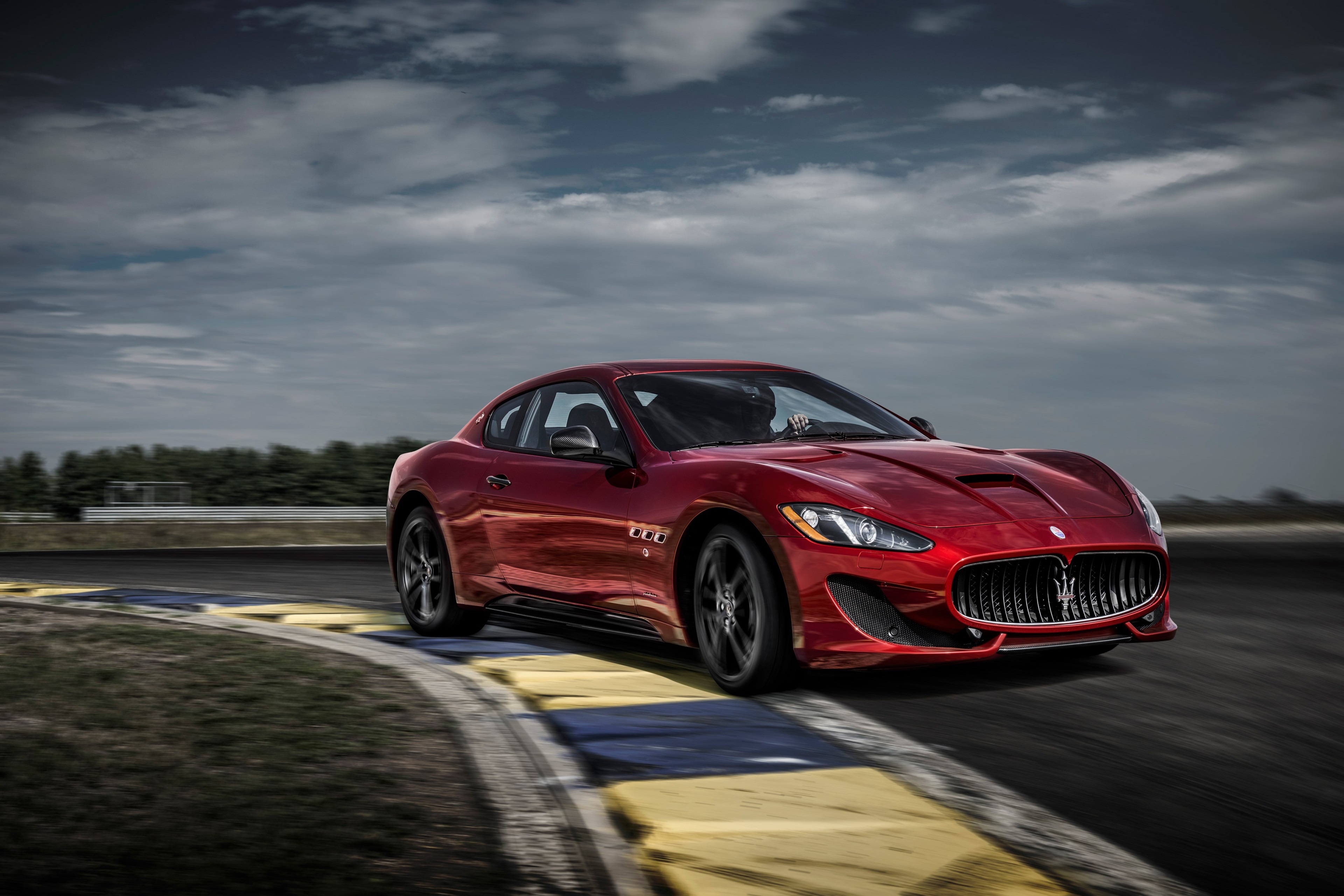 Red Maserati GranTurismo GT Sport on a Racetrack HD Wallpaper
