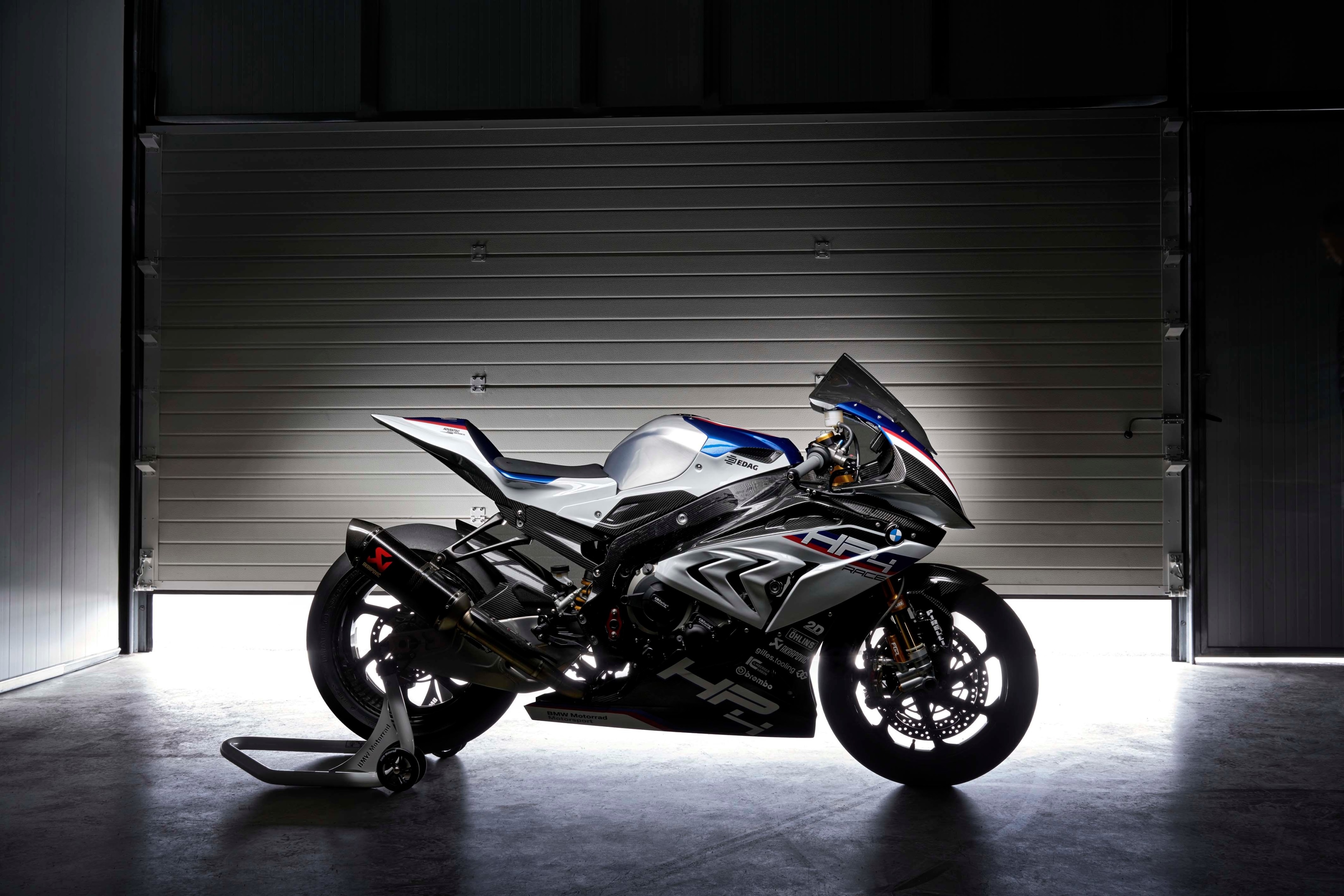 BMW HP4 Race motorcycle in a garage HD Wallpaper