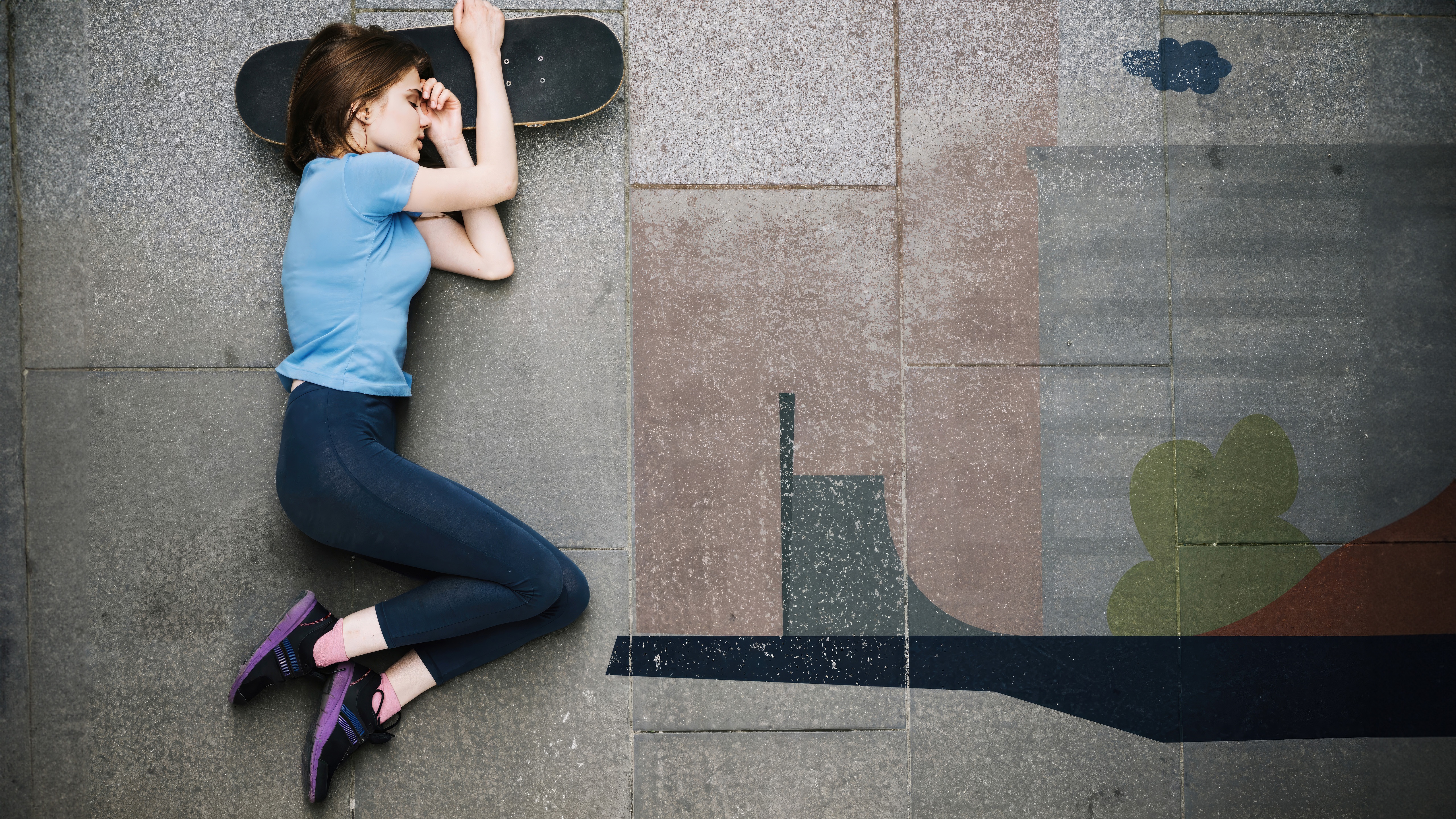 Girl sleeping on a skateboard on pavement HD Wallpaper