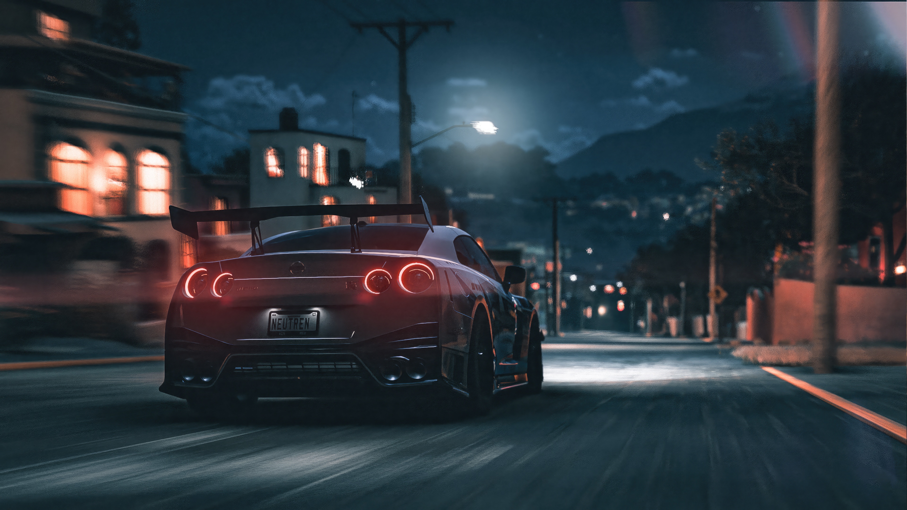 Nissan GTR driving through a town at night HD Wallpaper