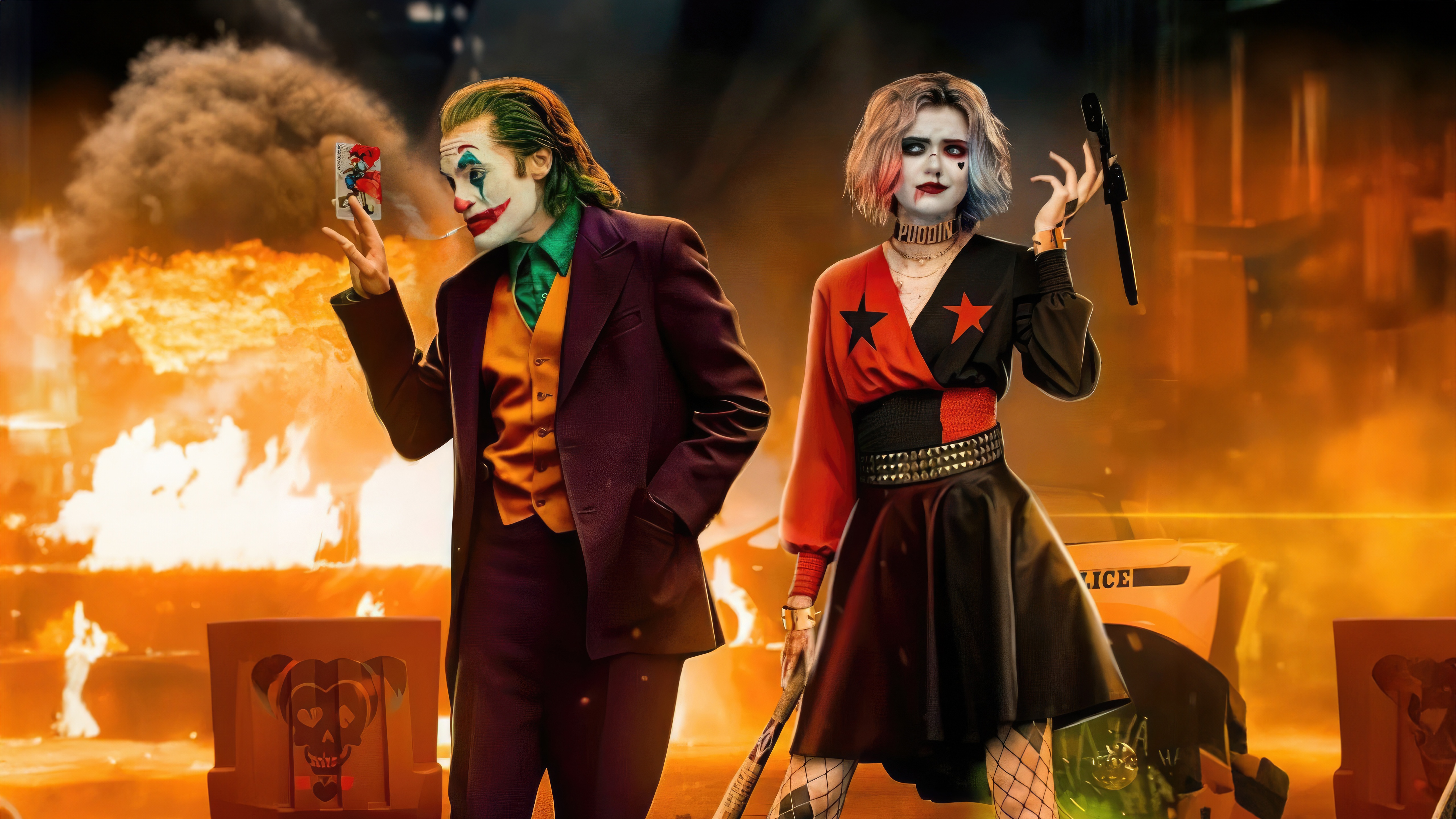 Joker and Harley Quinn in front of a fire HD Wallpaper