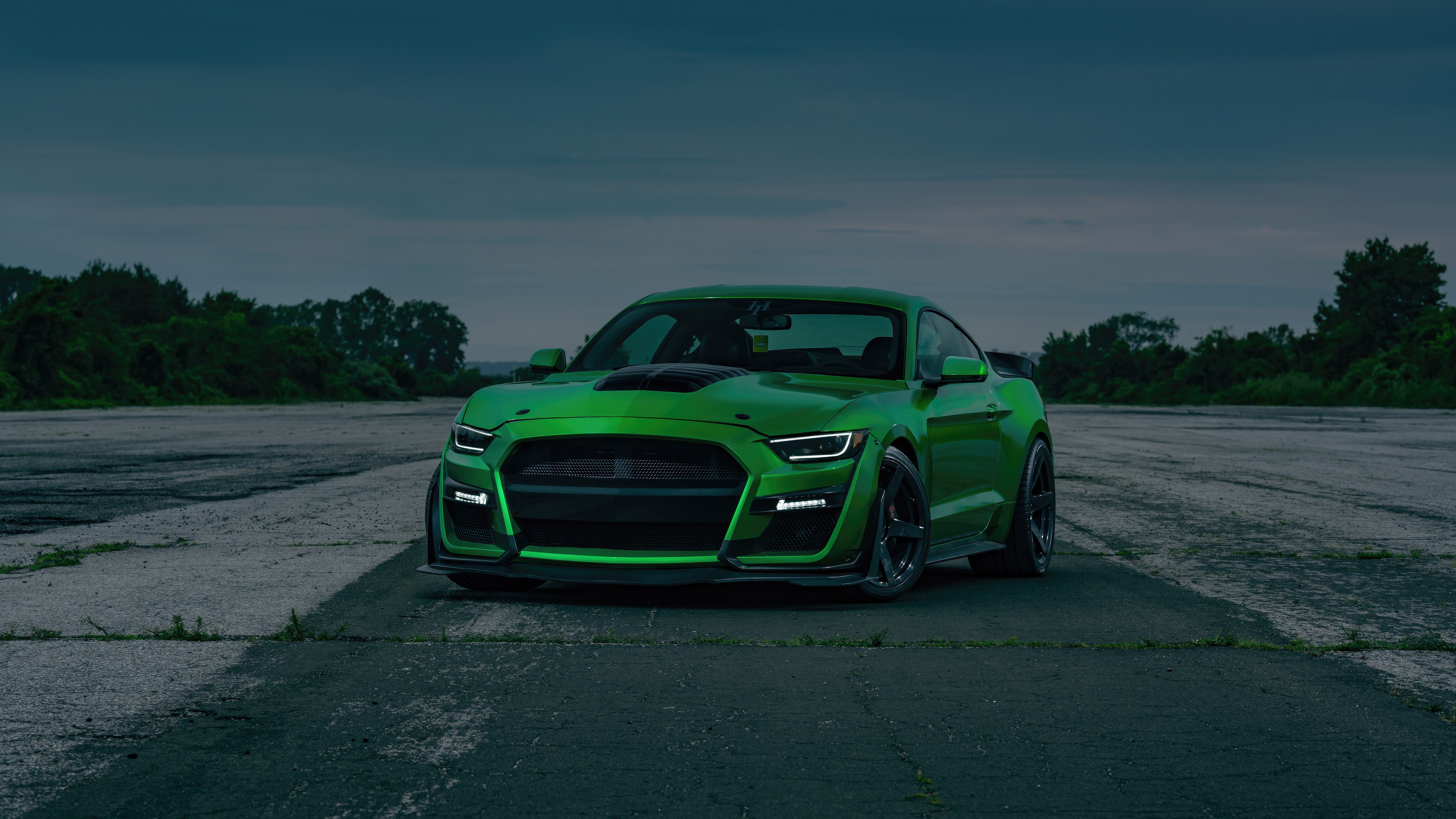 Green Ford Mustang parked on asphalt HD Wallpaper