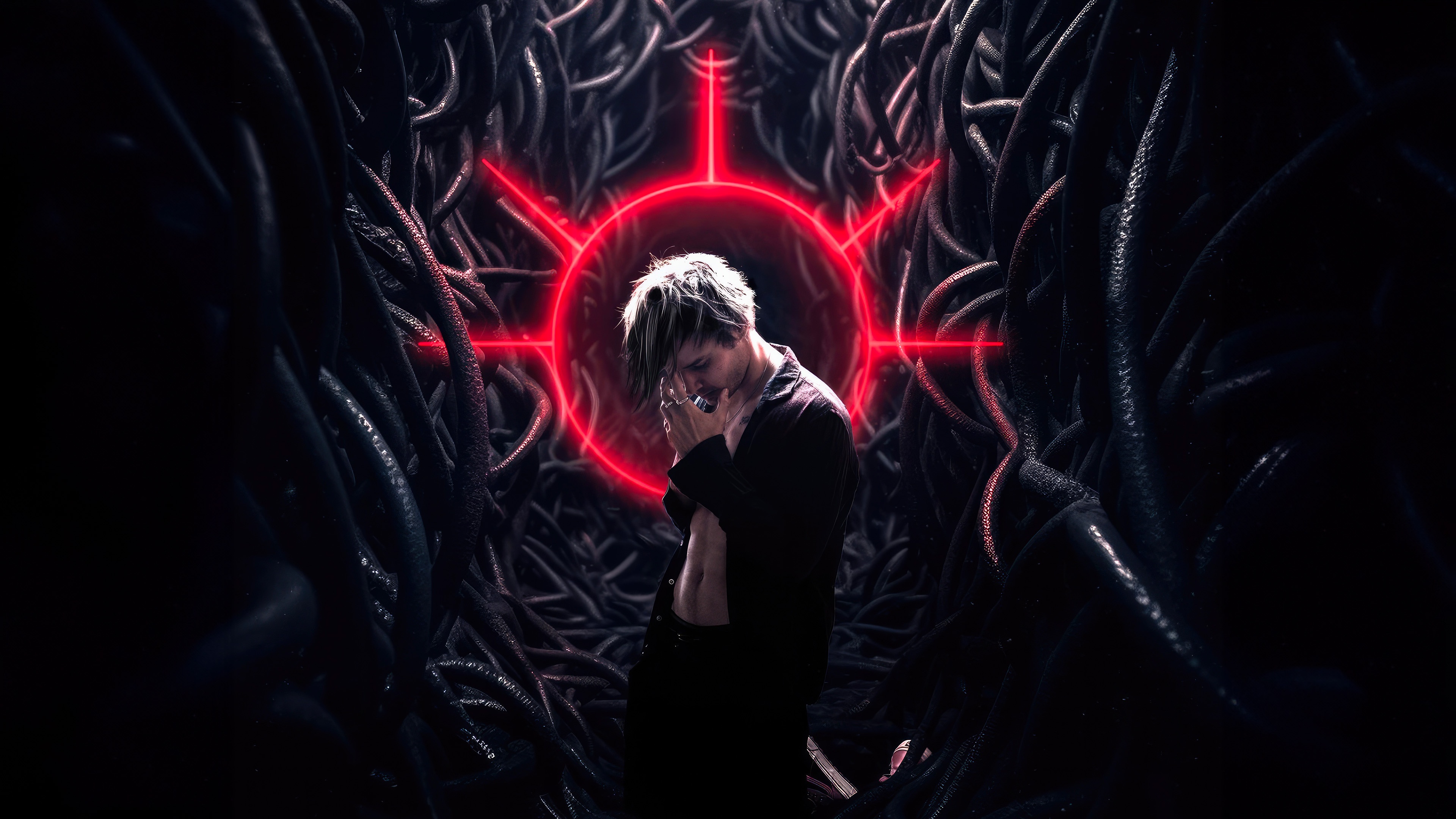 Man in front of a red symbol surrounded by dark tendrils HD Wallpaper