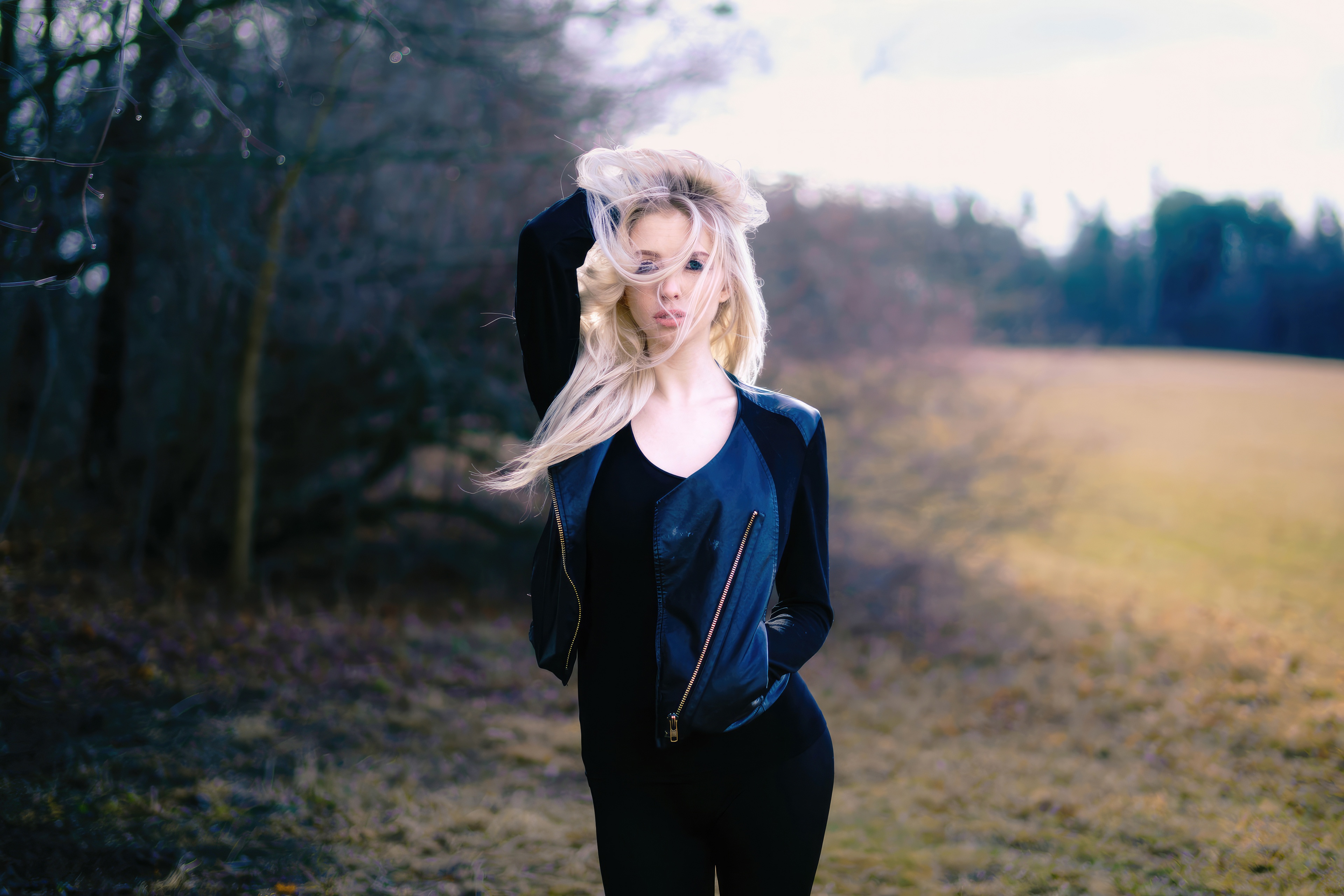 Woman with blonde hair in a black jacket HD Wallpaper