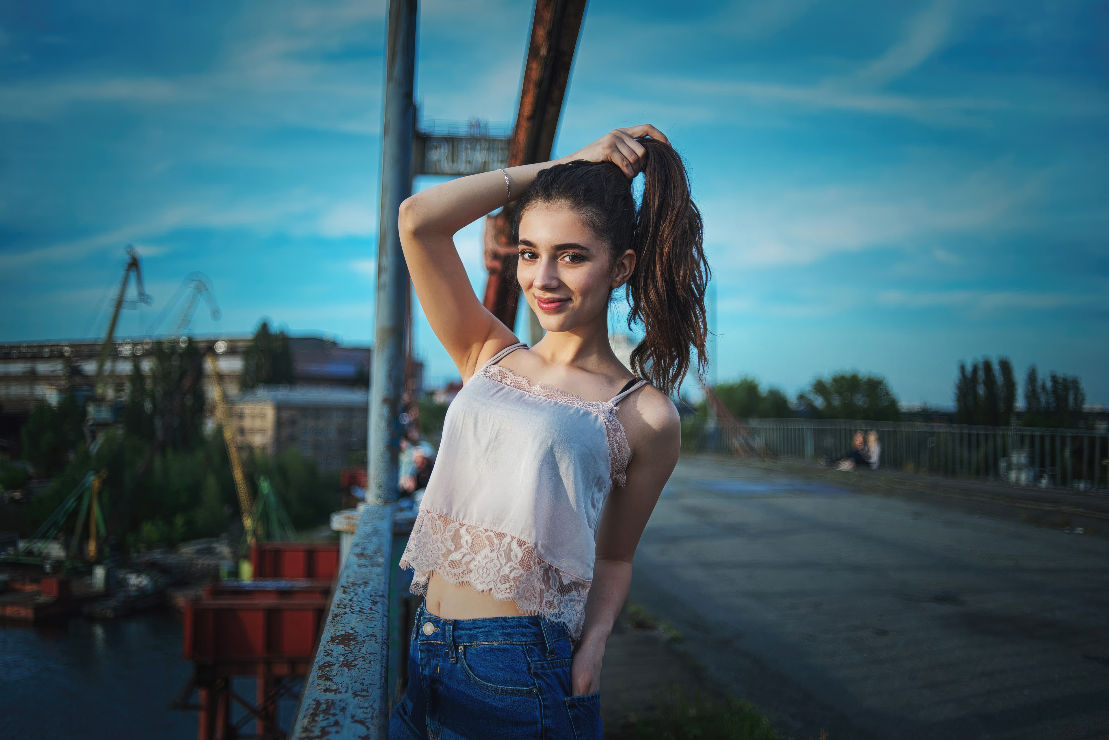 Girl with ponytail on a bridge HD Wallpaper