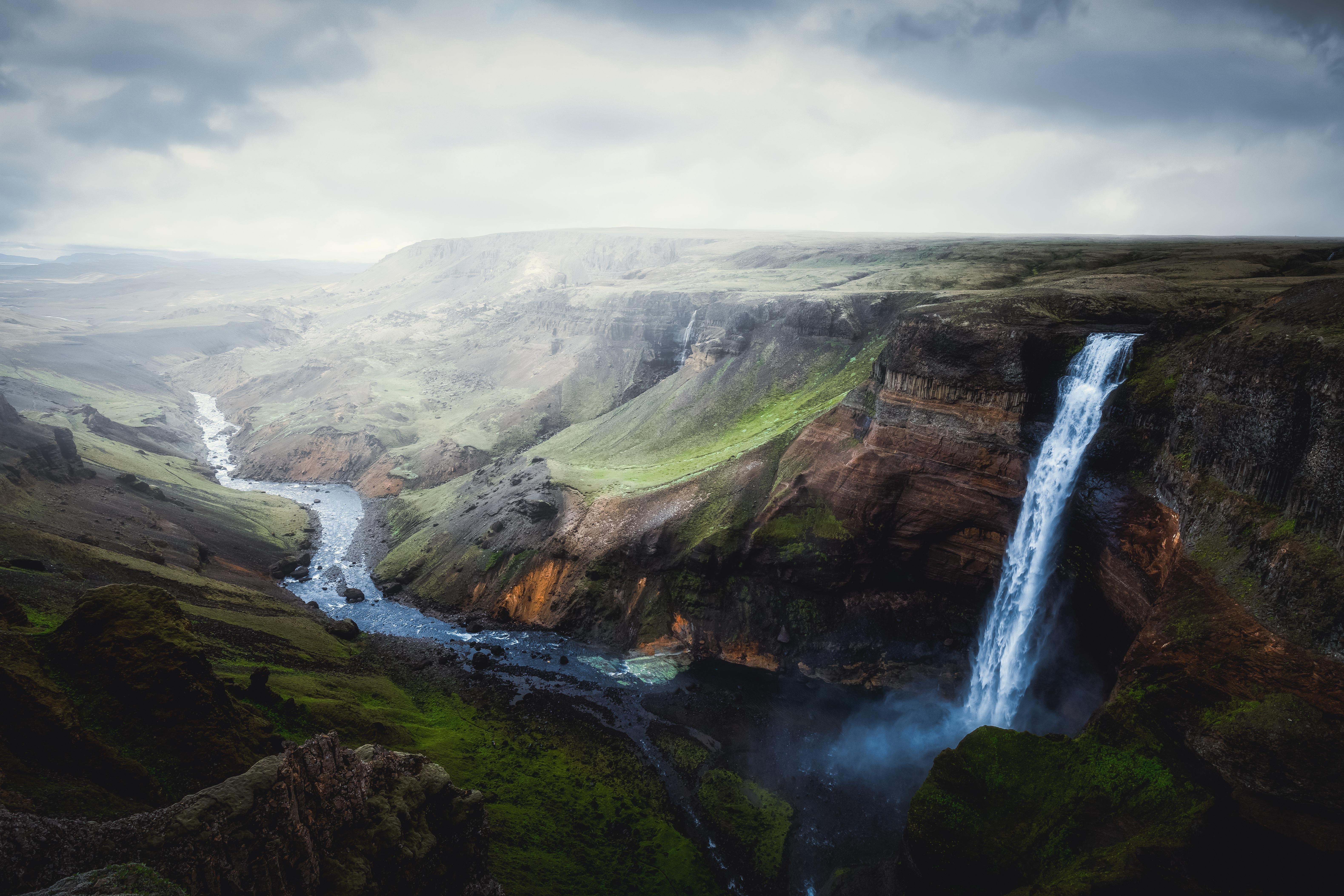 Waterfall in a canyon in Iceland HD Wallpaper