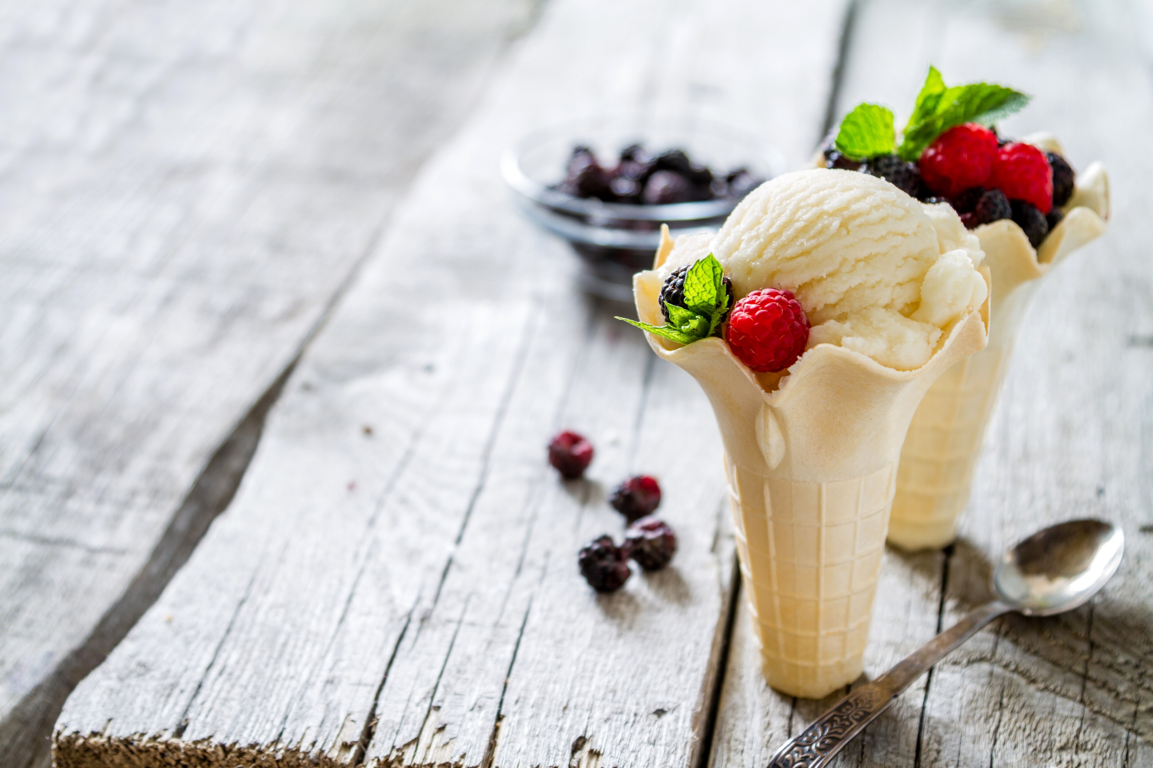Ice cream with berries on a wooden table HD Wallpaper