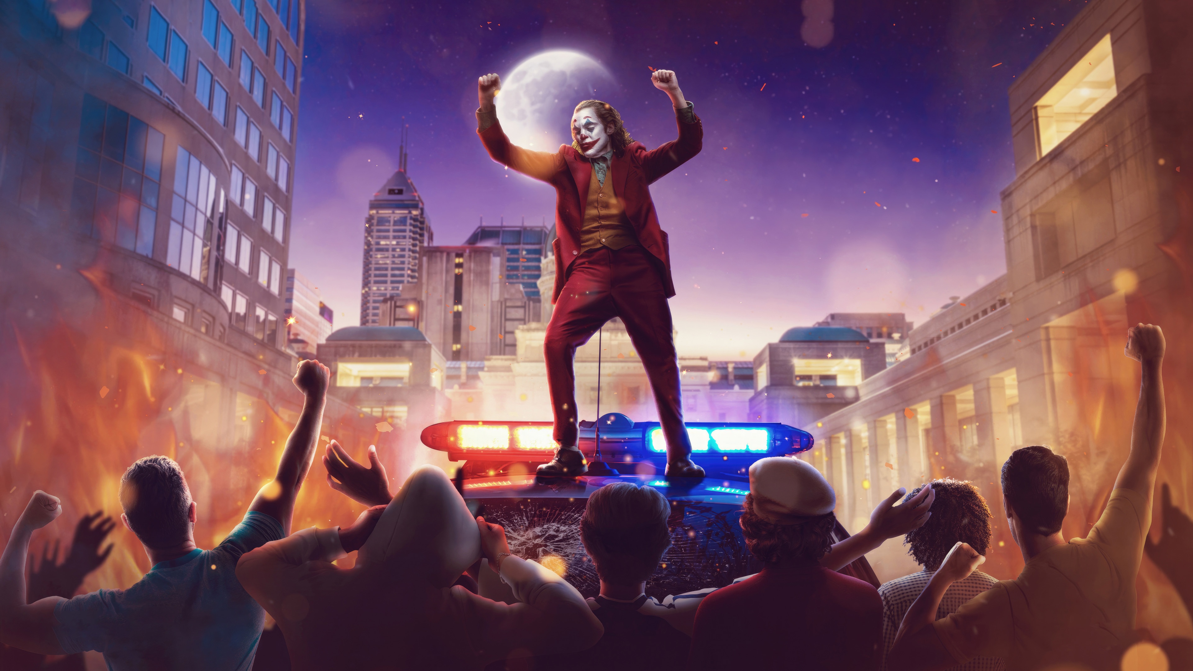 Joker standing on police lights during a riot HD Wallpaper