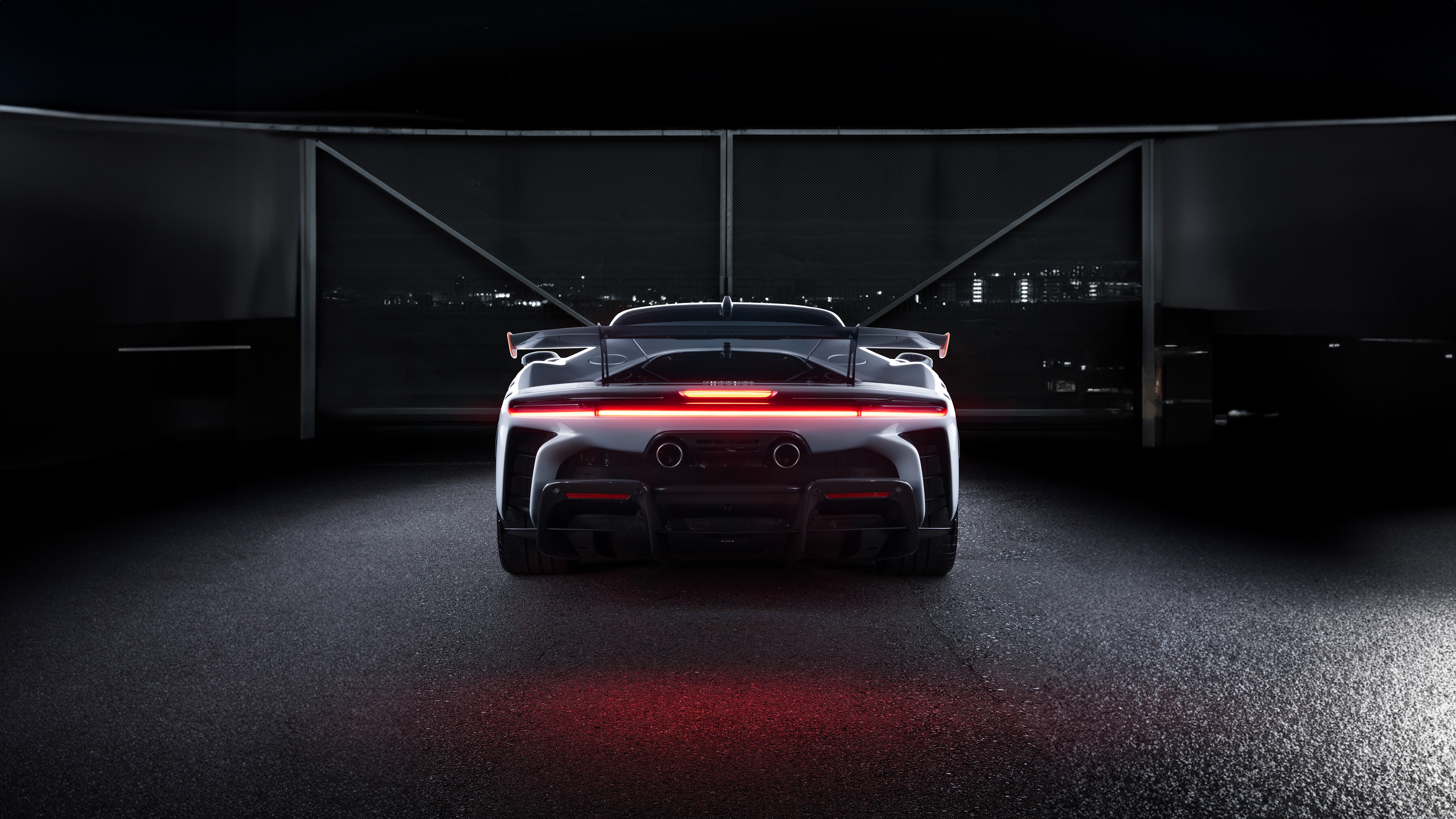 Rear view of a black Ferrari SF90 Stradale HD Wallpaper