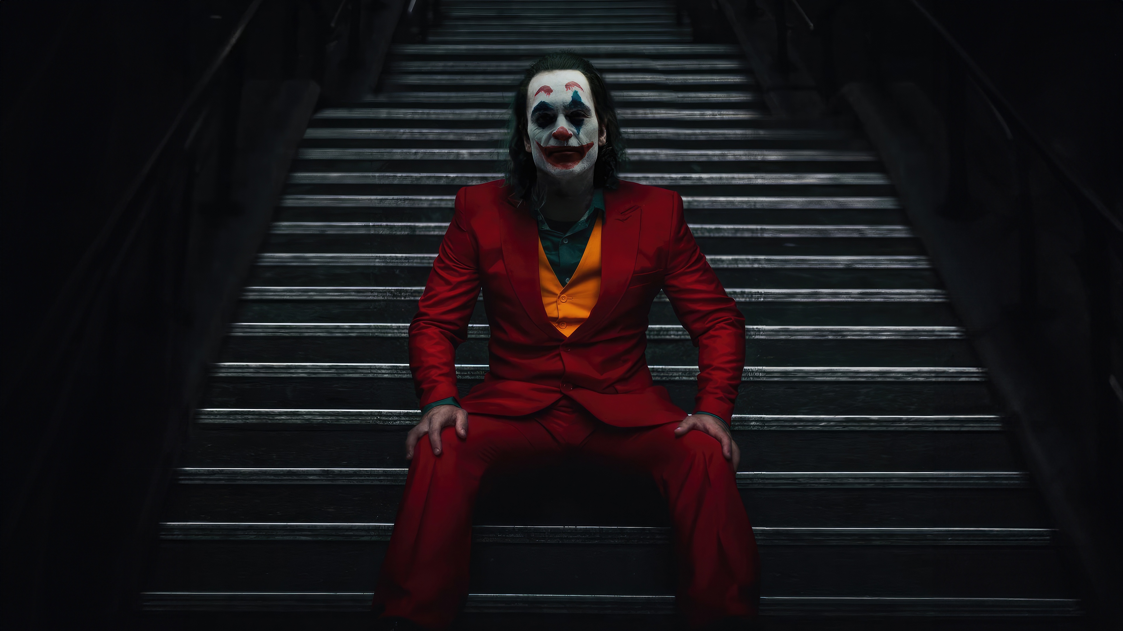 Joker sitting on stairs HD Wallpaper