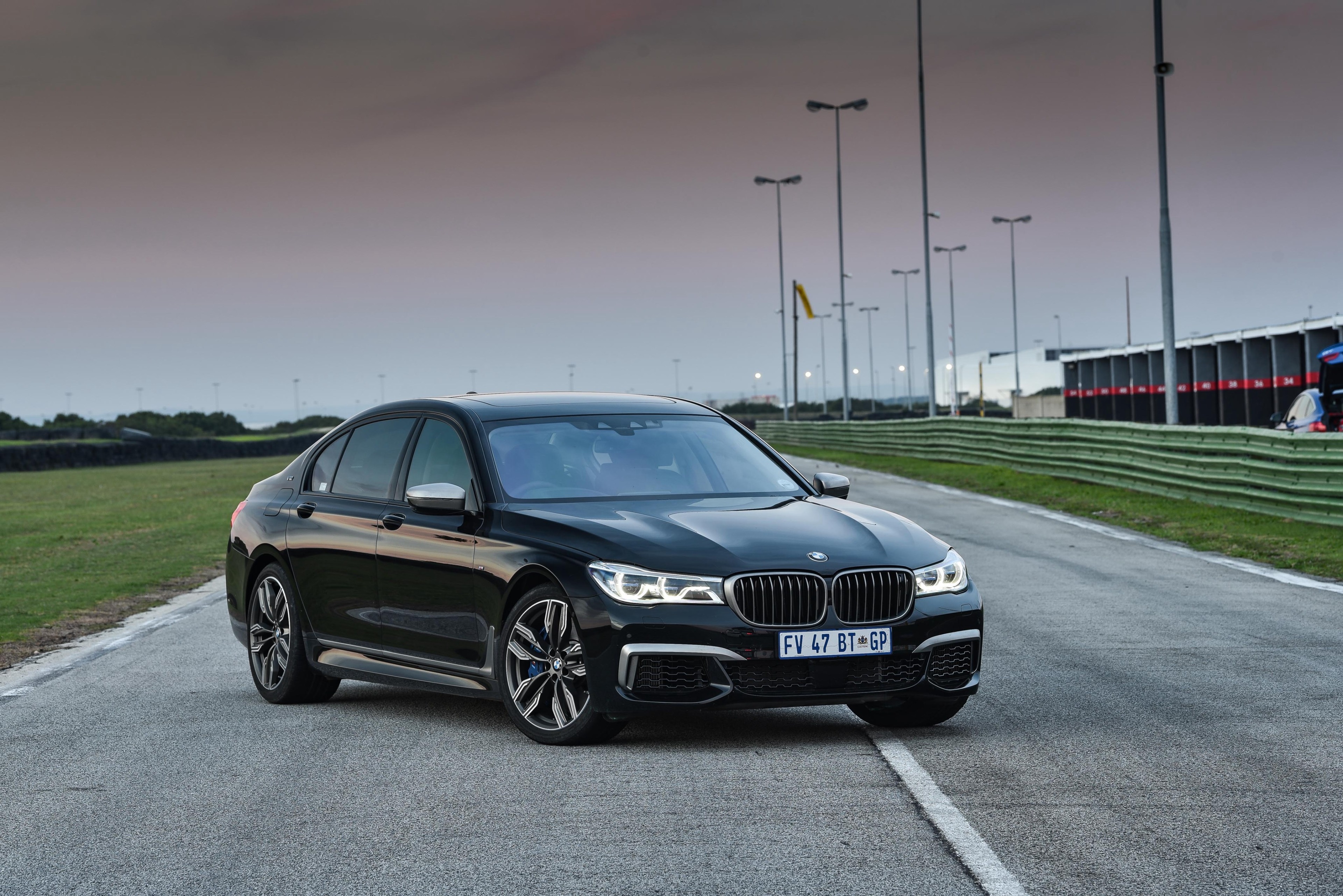 Black BMW 7 Series on a Race Track HD Wallpaper
