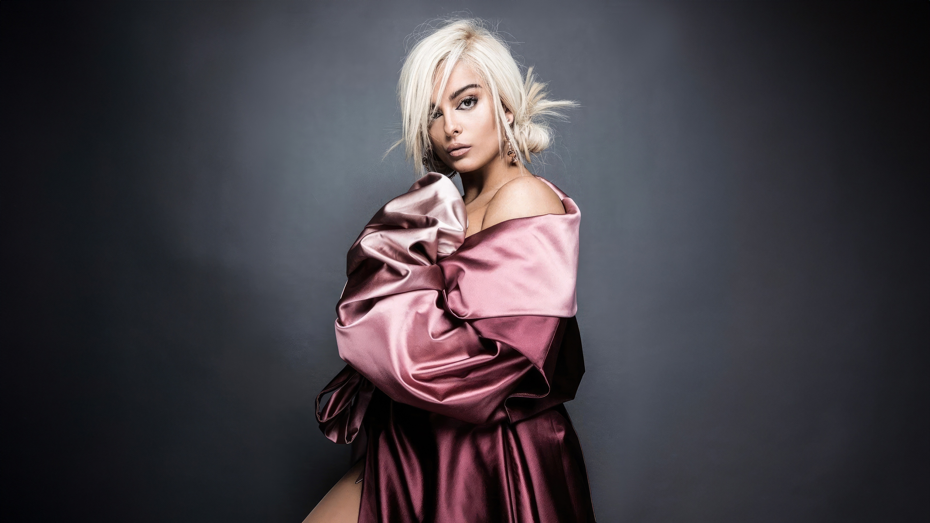 Bebe Rexha posing in a satin dress HD Wallpaper
