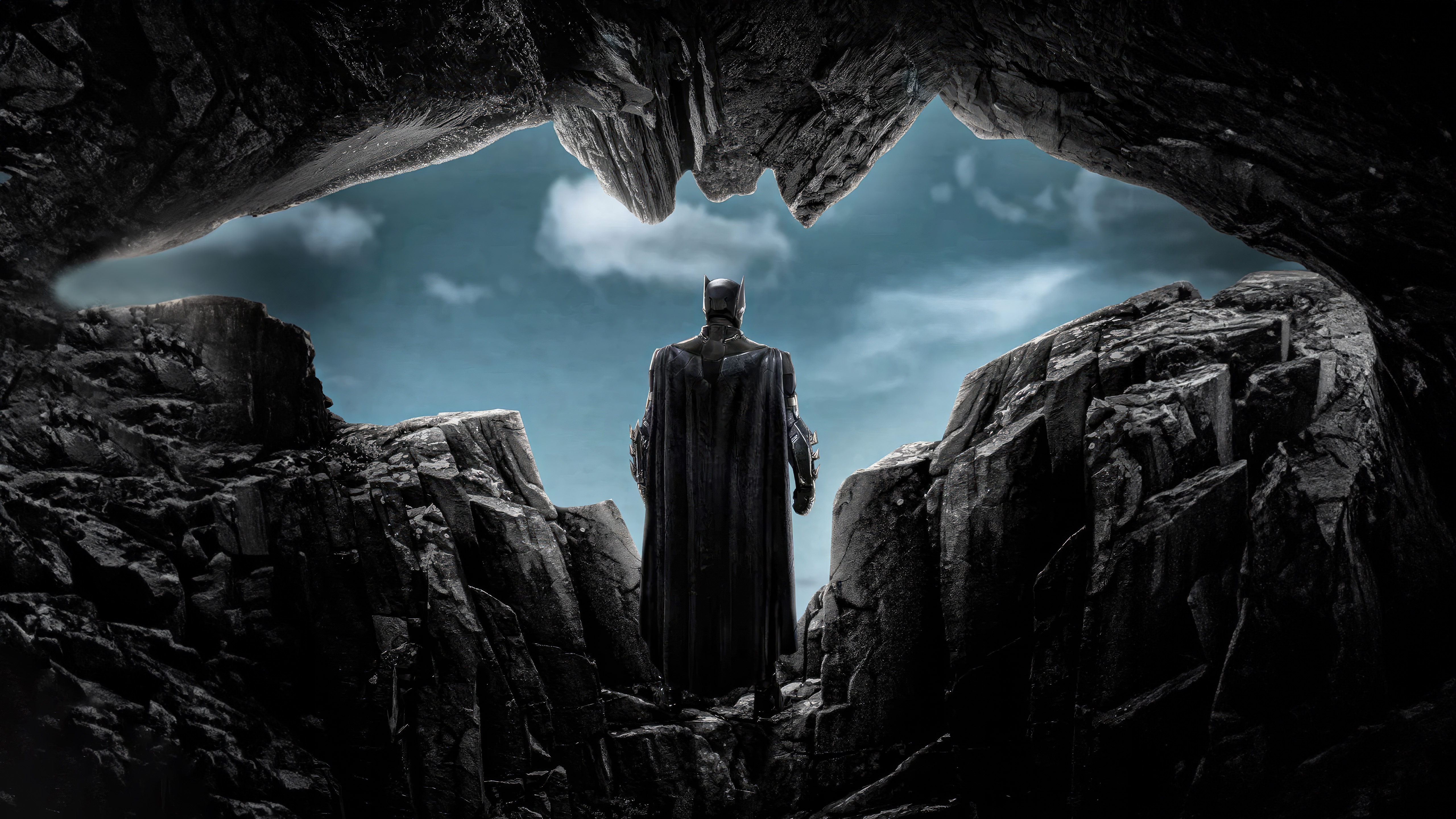 Batman standing in a cave entrance HD Wallpaper