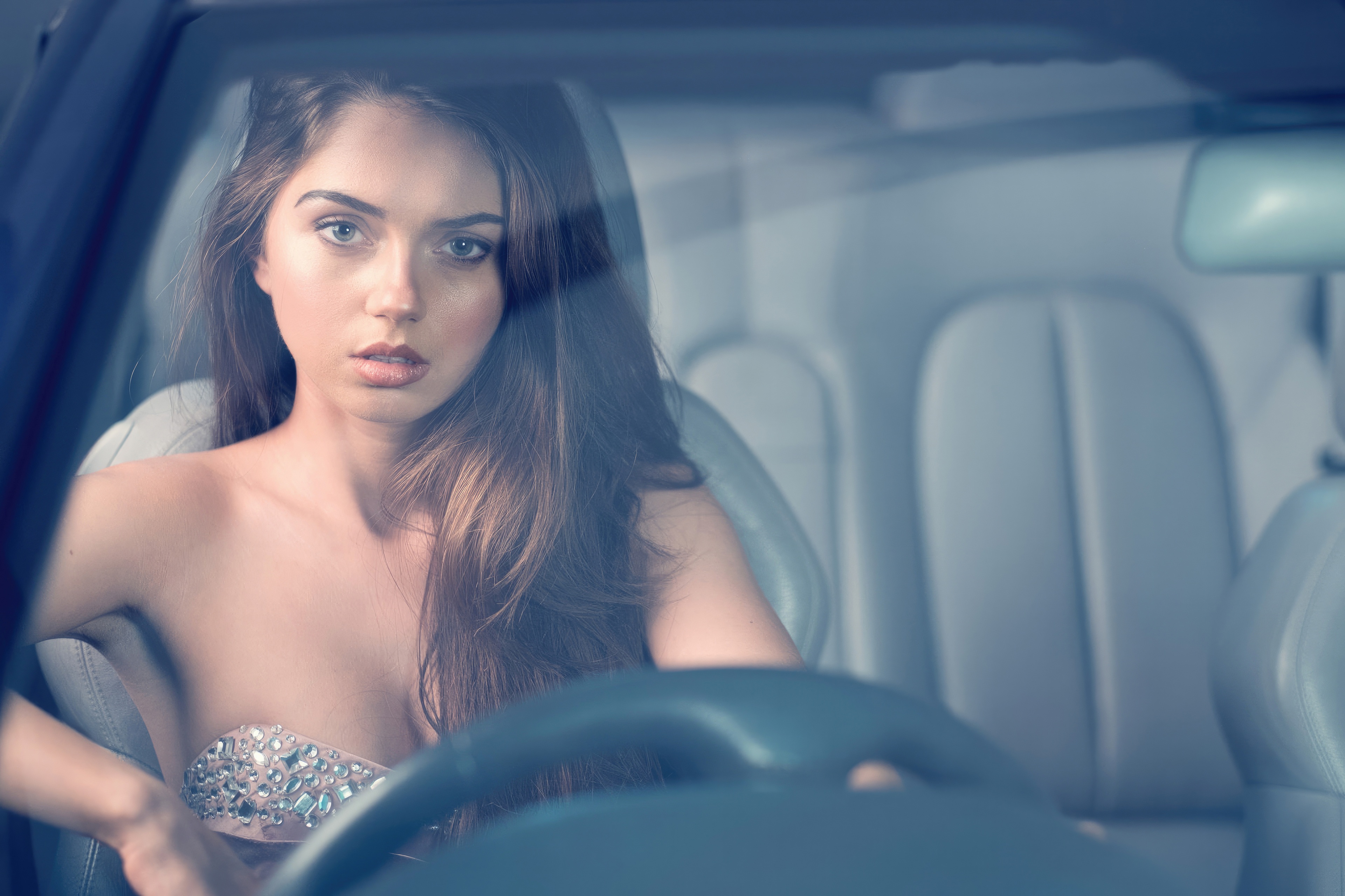 Woman in a car wearing a jeweled top HD Wallpaper