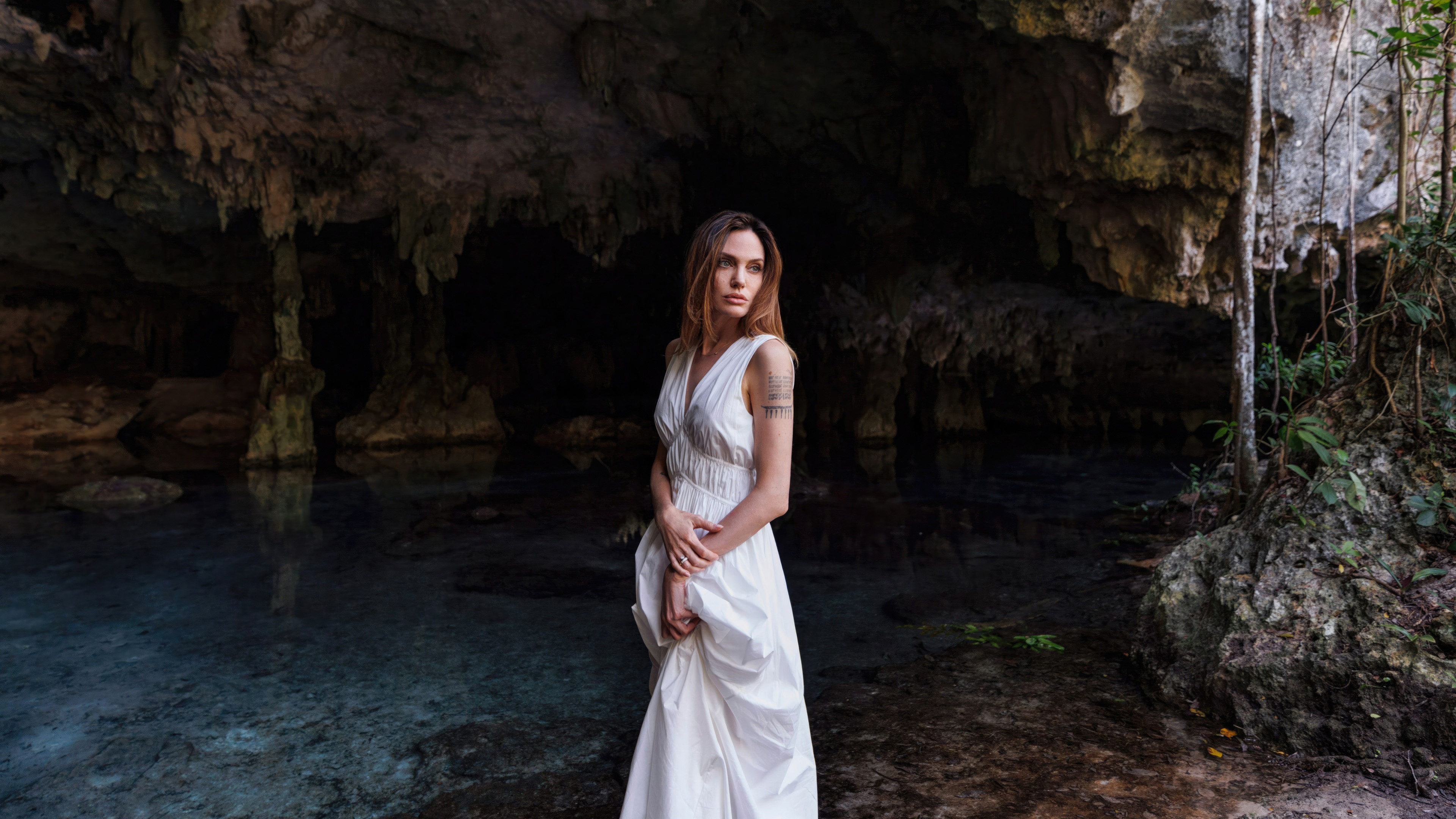 Angelina Jolie in a white dress in a cave HD Wallpaper