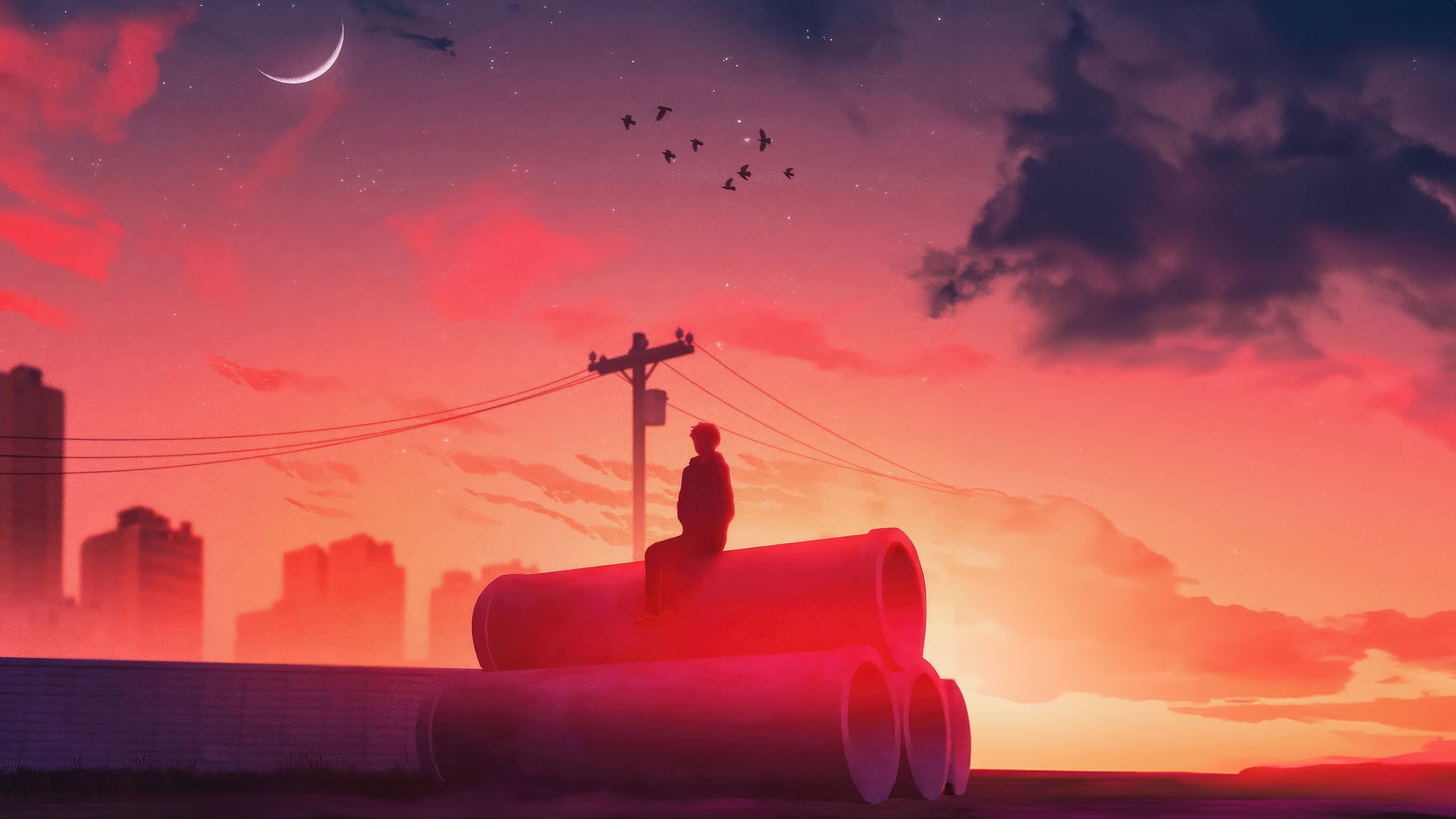 Person sitting on pipes during sunset with city skyline HD Wallpaper