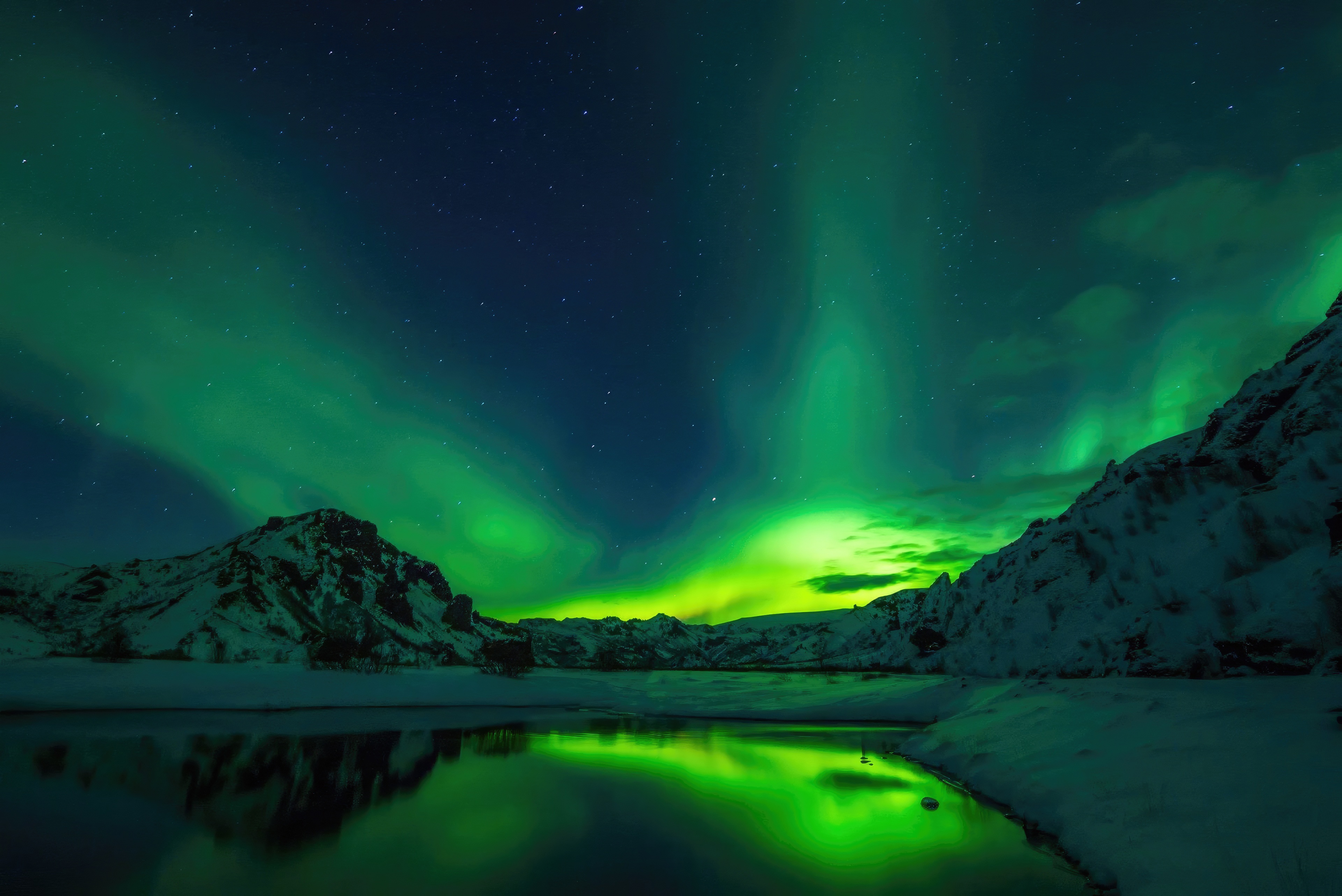 Aurora Borealis over snowy mountains in Iceland HD Wallpaper