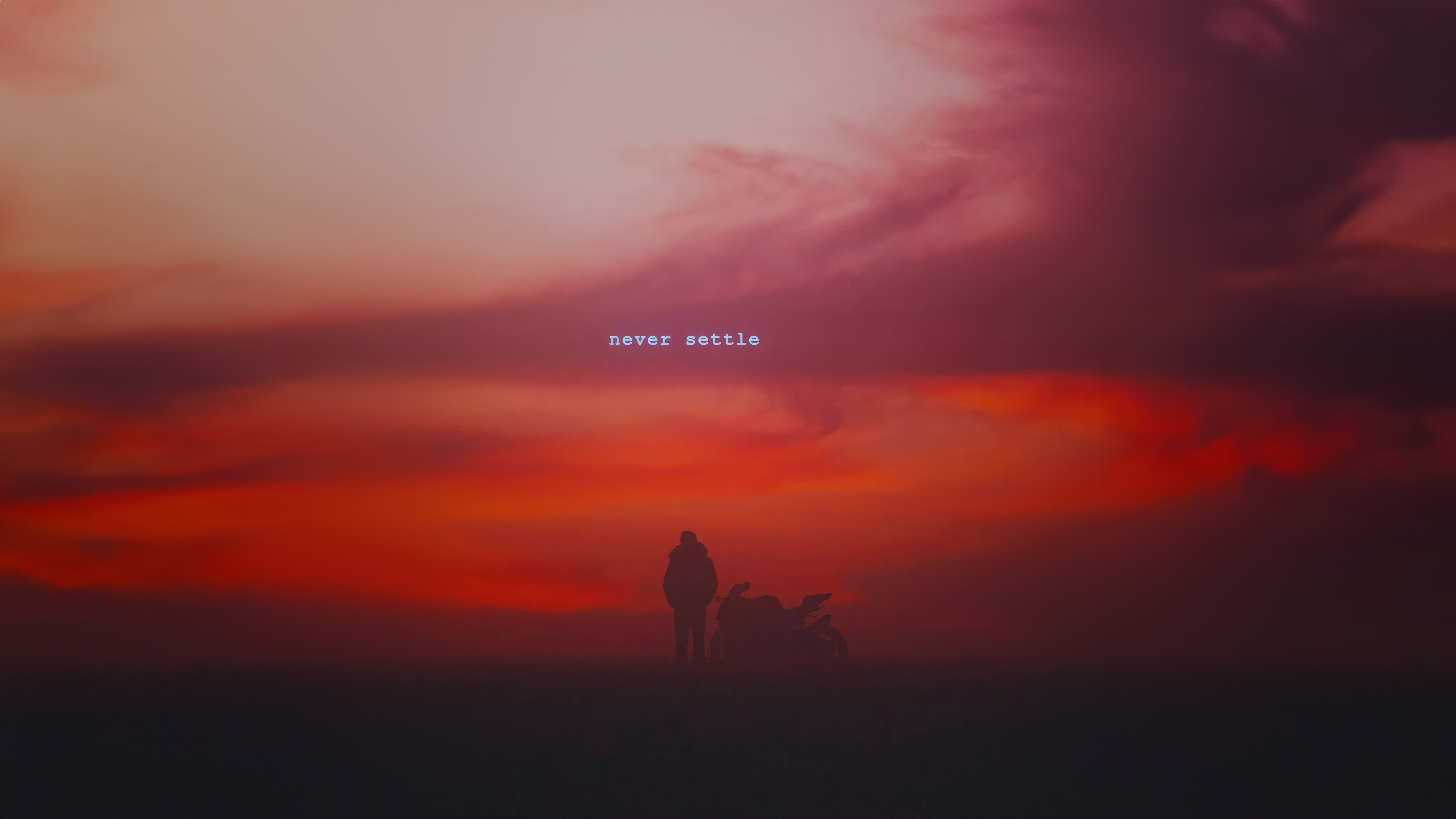 Silhouette of a person and motorcycle against a sunset sky with text HD Wallpaper