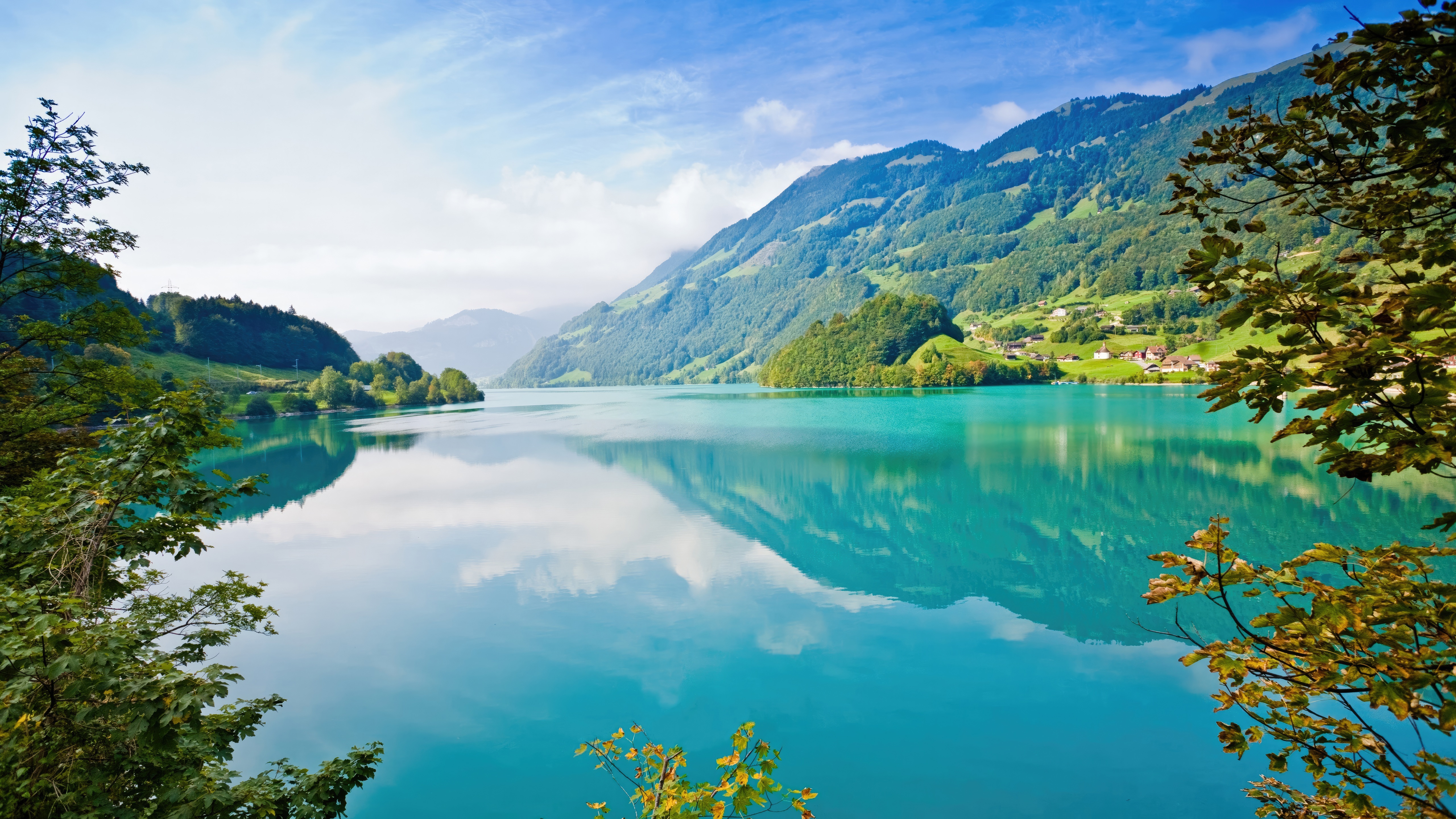 Turquoise lake reflecting mountains and trees HD Wallpaper