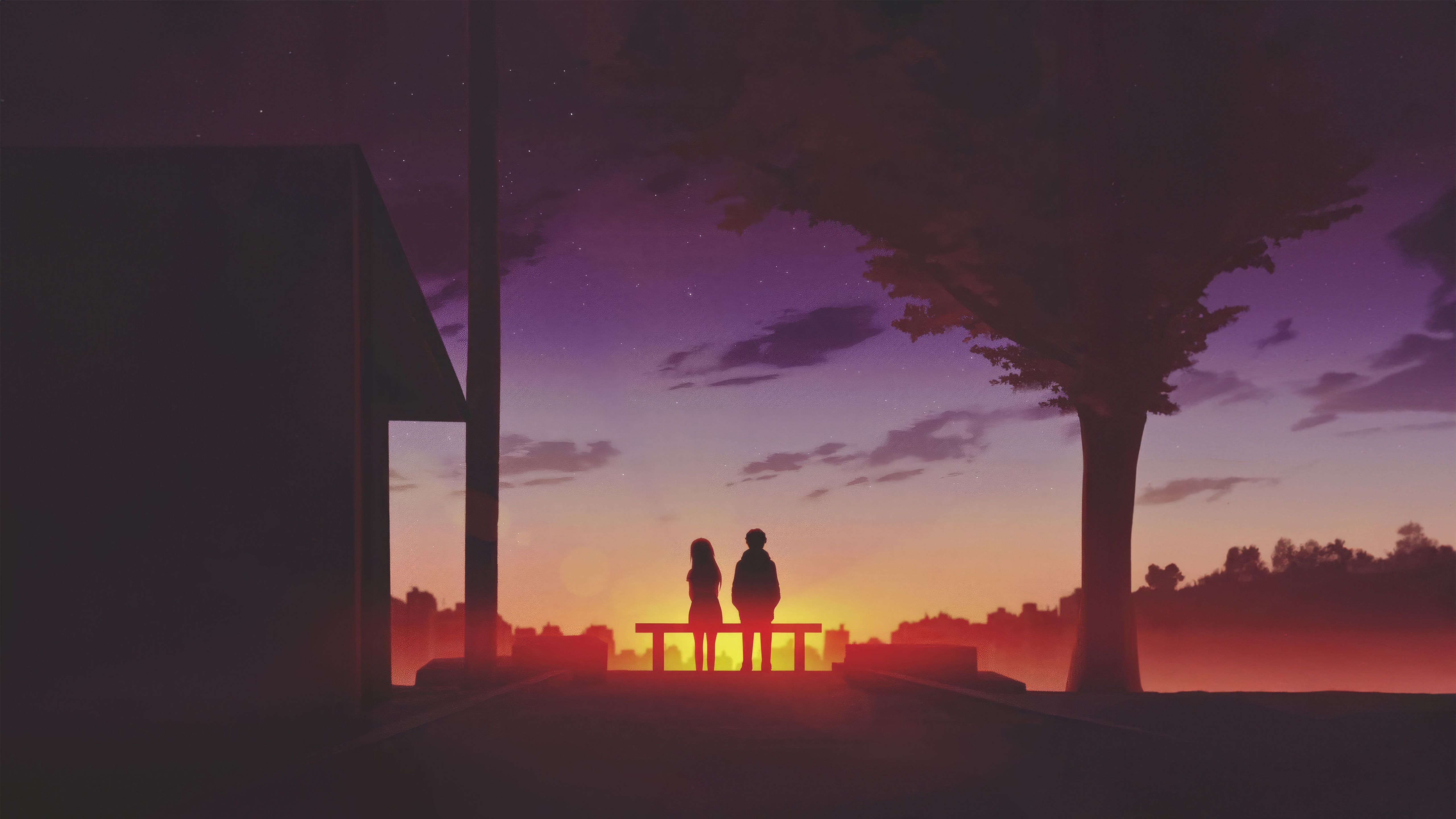 Two figures sit on a bench at sunset HD Wallpaper