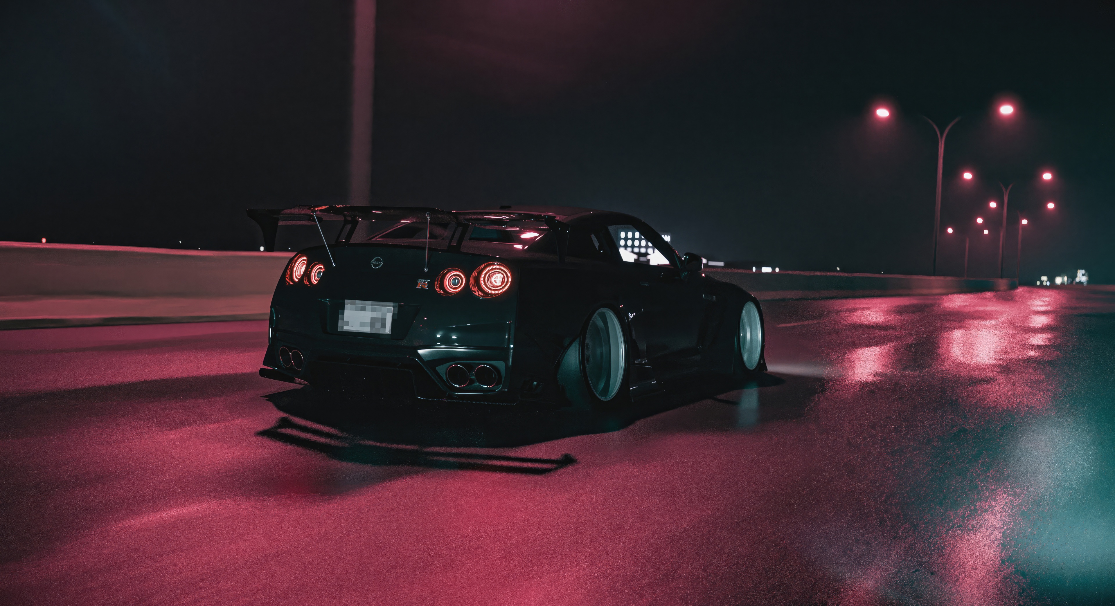 Nissan GTR on a wet road at night HD Wallpaper