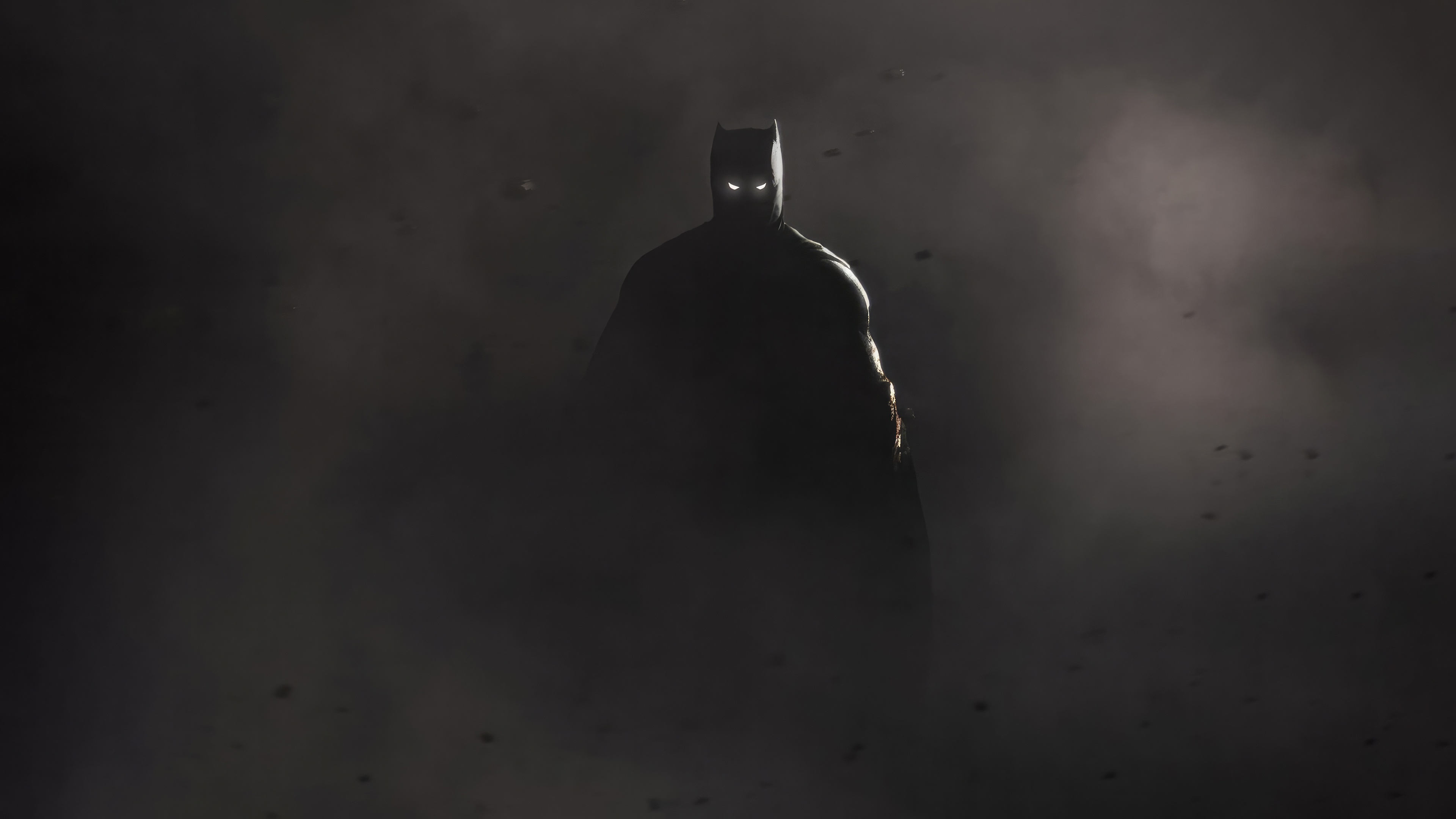 Batman emerges from smoke with glowing eyes HD Wallpaper