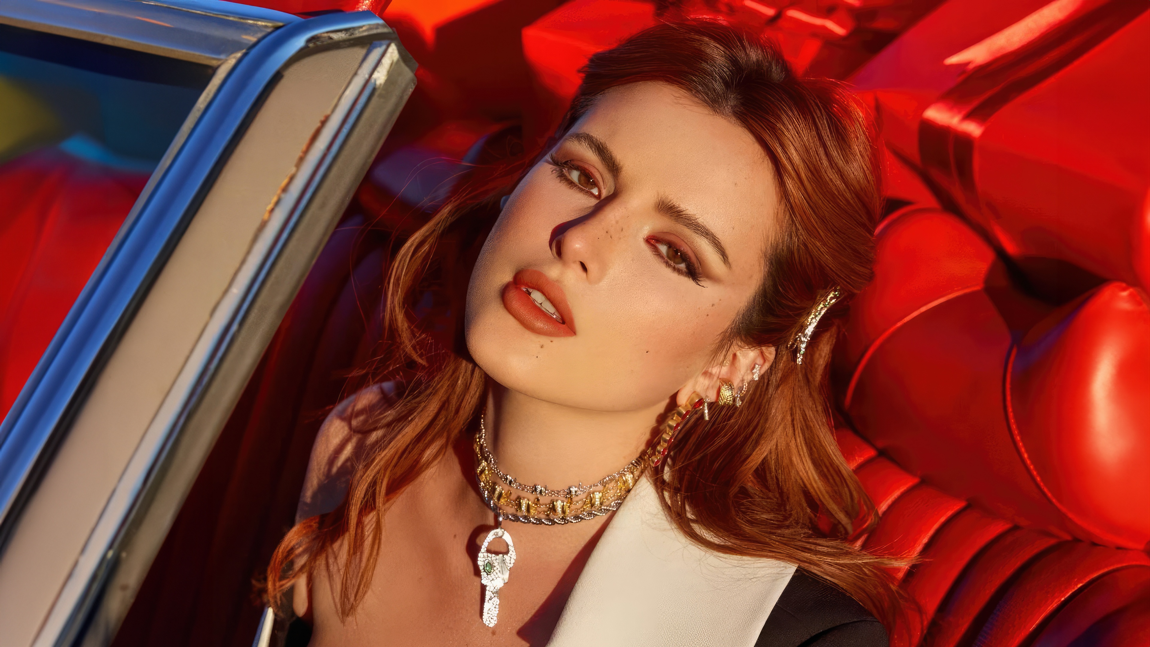 Bella Thorne in a red car with gifts HD Wallpaper
