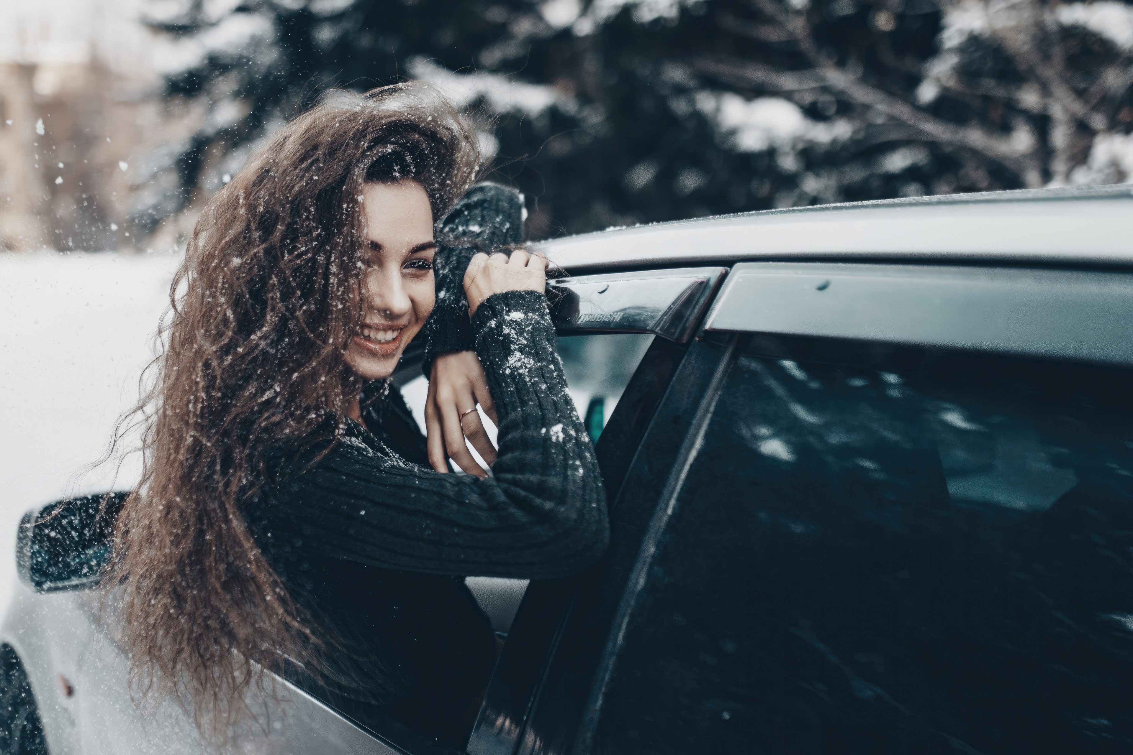 Girl In Snow Coming Out Of Car Window HD Wallpaper