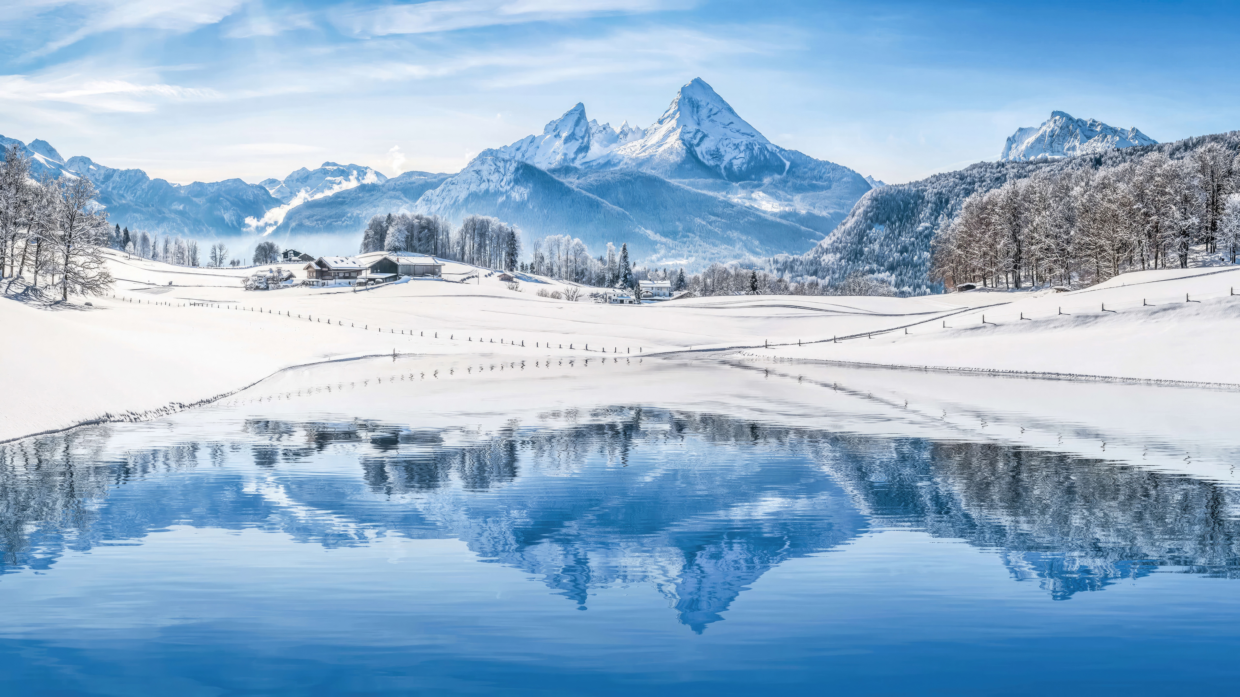 Snowy mountains reflected in a calm lake HD Wallpaper