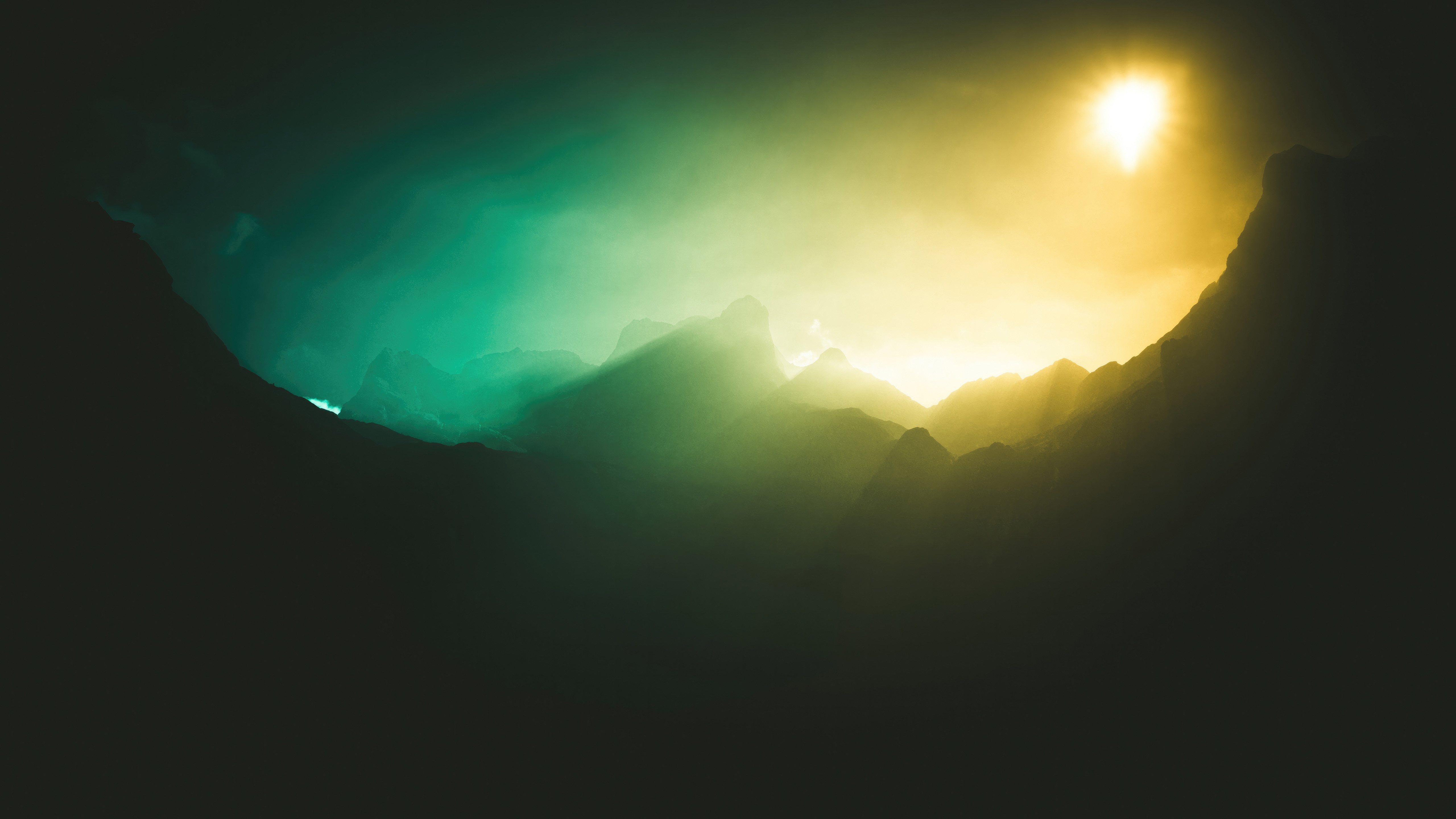 Sunlight beams through misty mountains HD Wallpaper