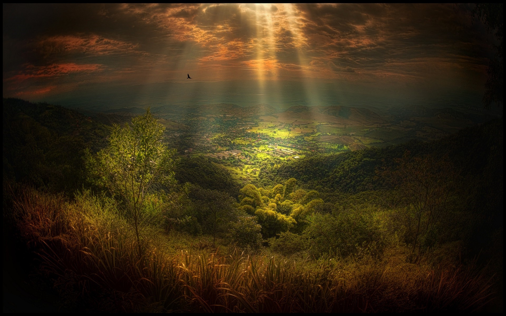 Sunlight Rays Over Lush Green Valley and Village HD Wallpaper