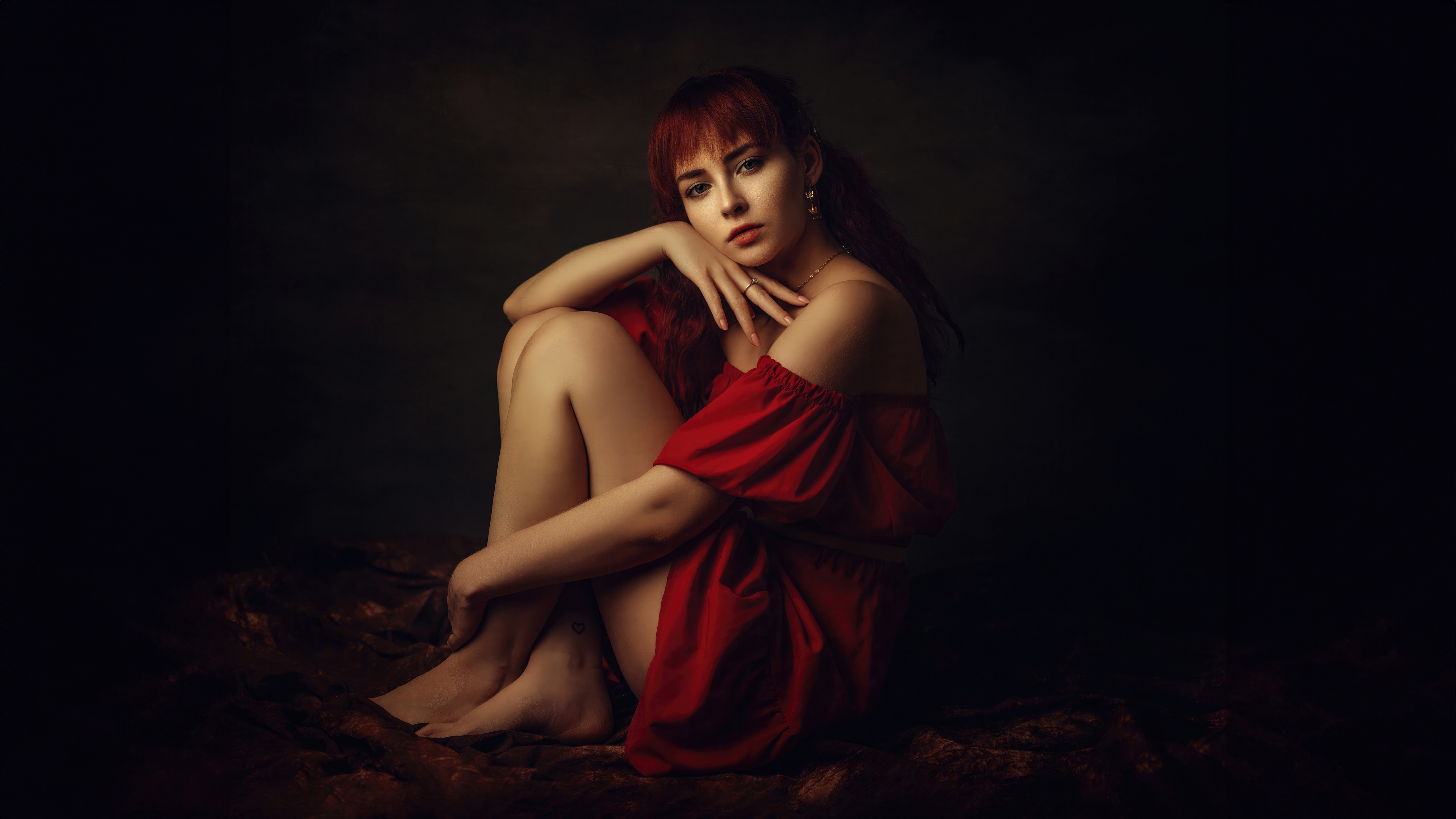 Woman in a red dress sitting HD Wallpaper