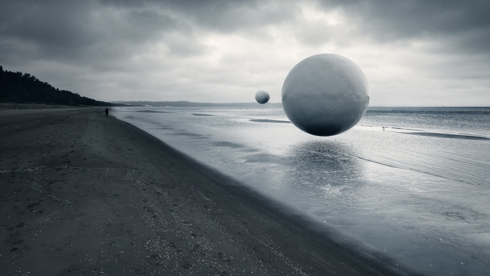 Monochrome beach with floating spheres and lone figure HD Wallpaper