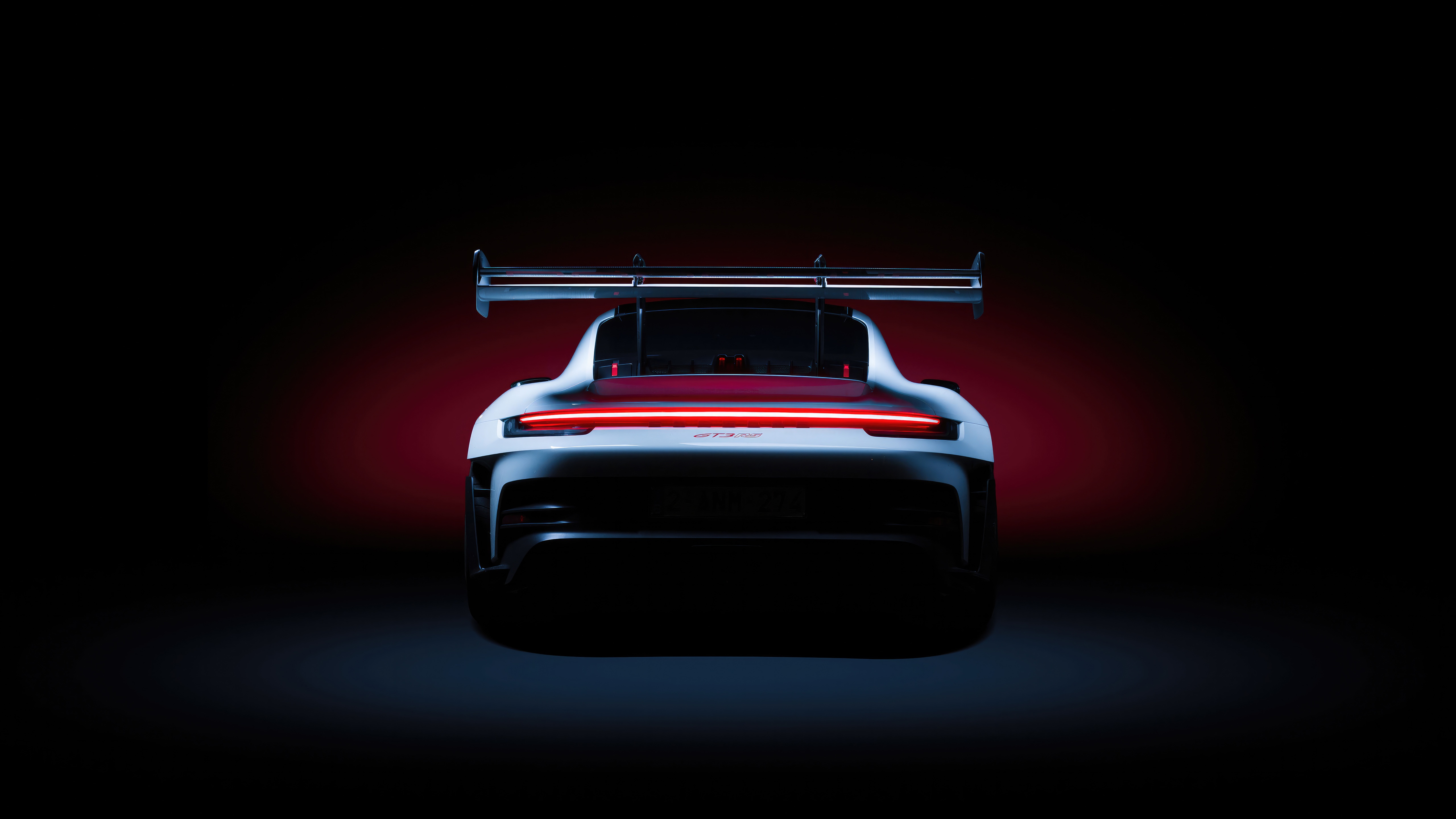Rear view of a white Porsche 911 GT3 RS 2024 HD Wallpaper
