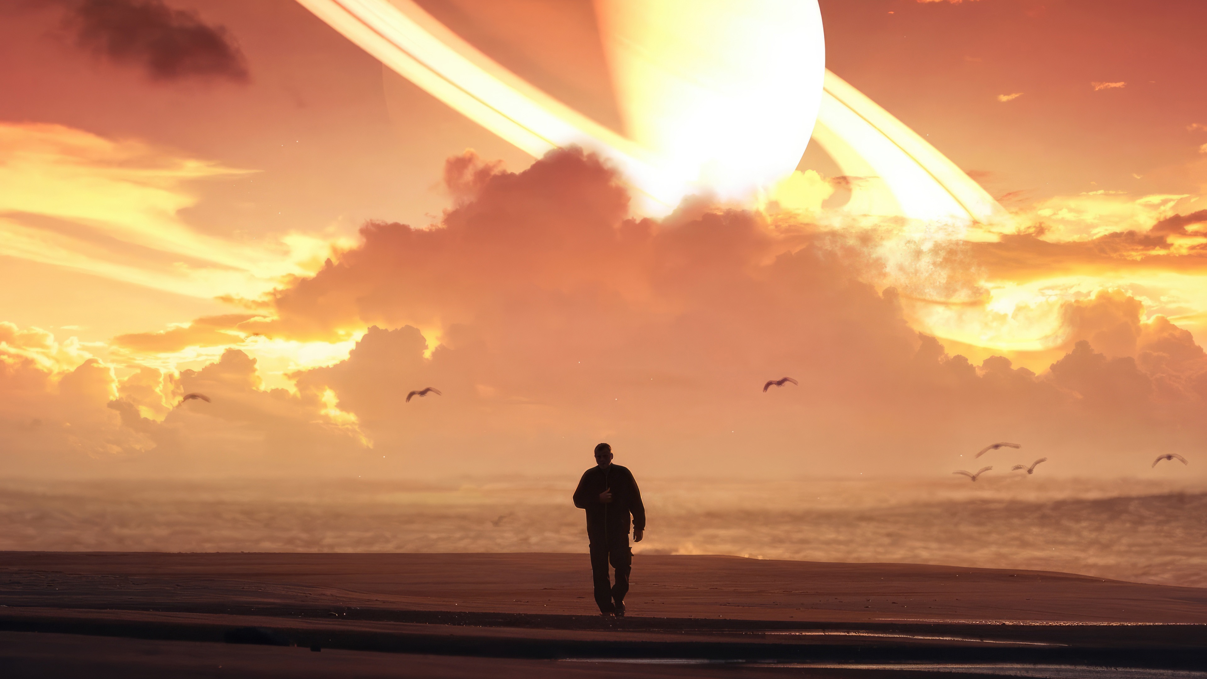 Man walks on beach with Saturn-like planet in sky HD Wallpaper