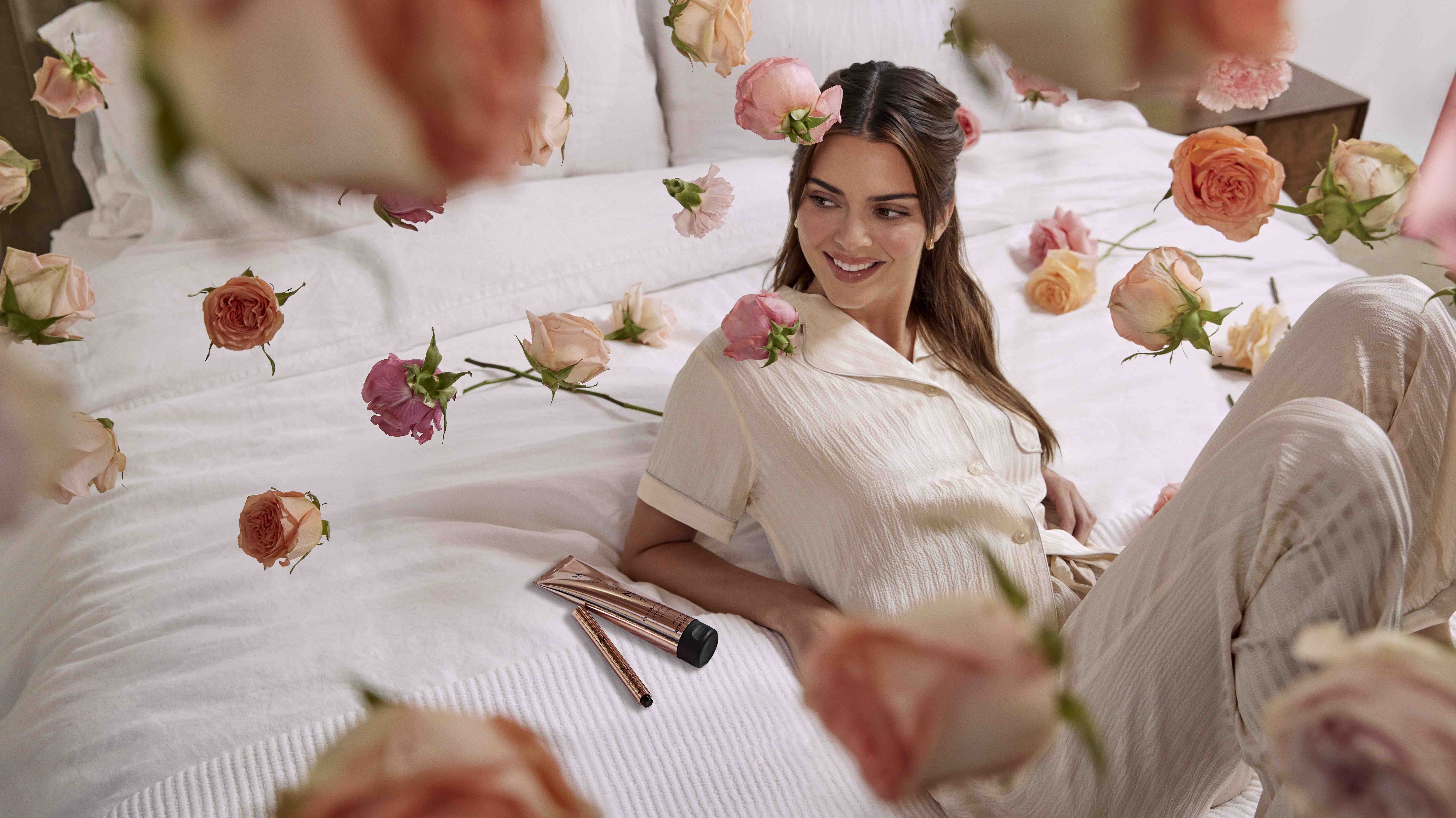 Kendall Jenner in pajamas surrounded by roses HD Wallpaper