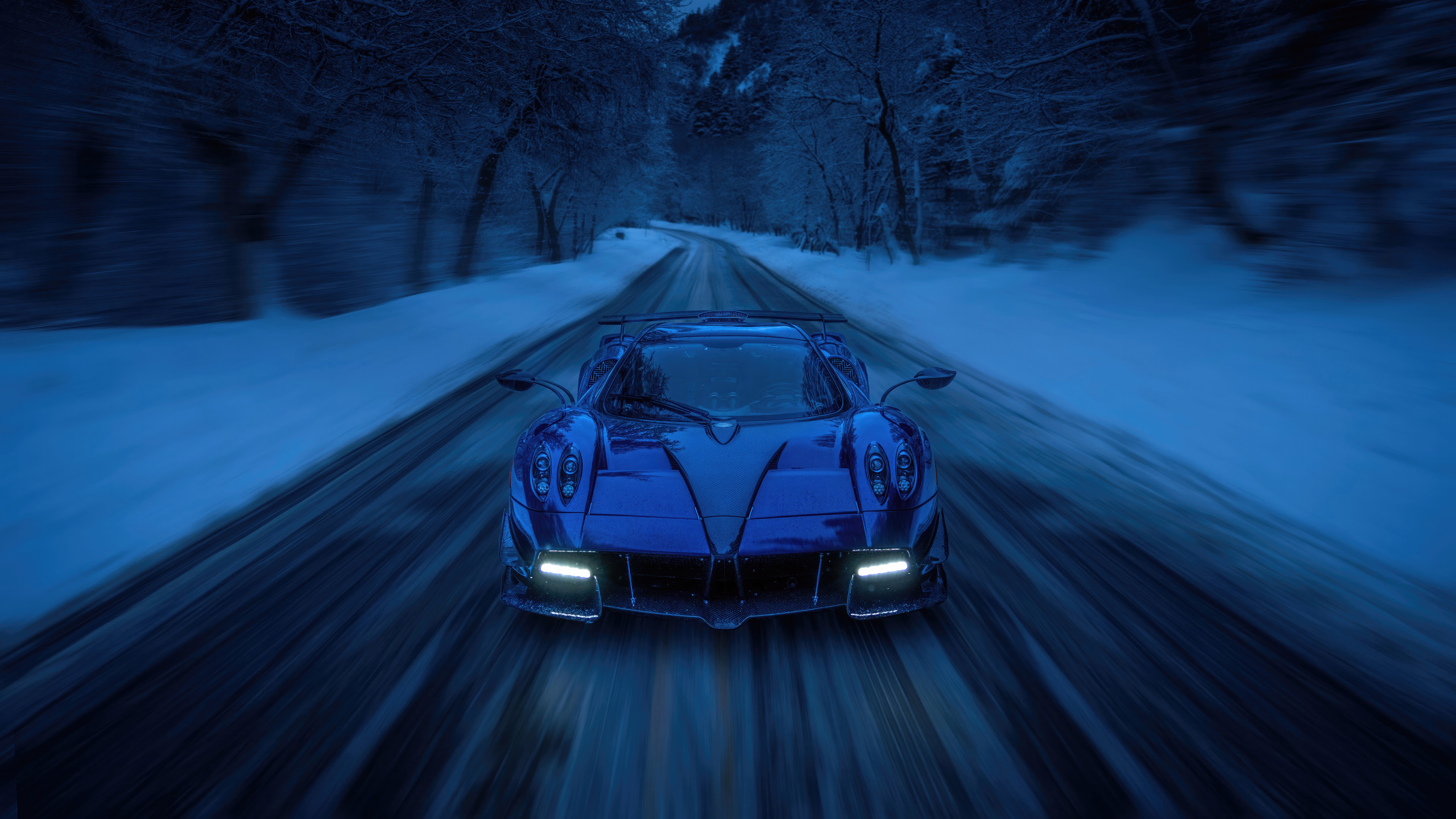 Blue Pagani Huayra Roadster driving on a snowy road HD Wallpaper