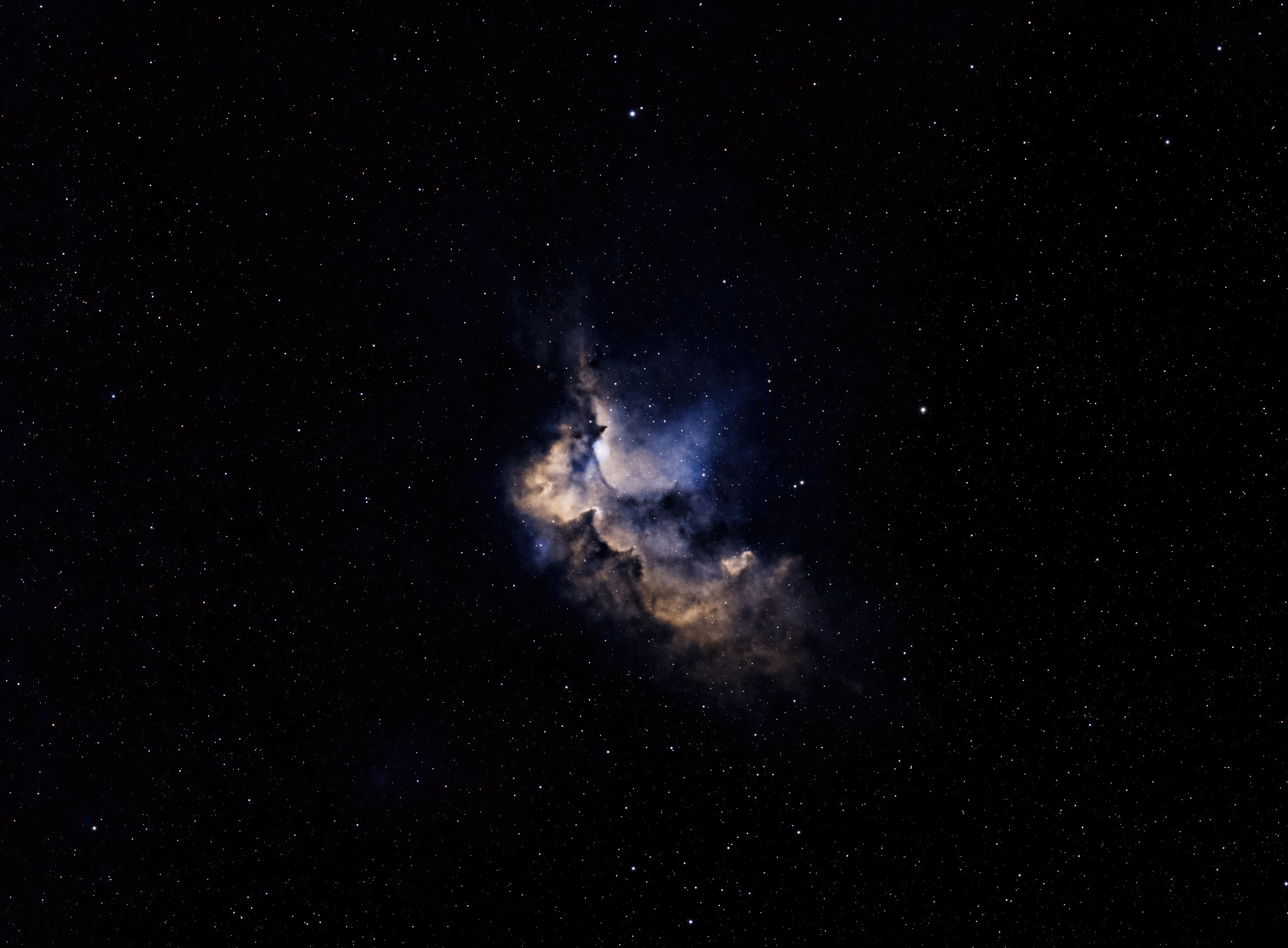 A colorful nebula surrounded by stars in deep space HD Wallpaper